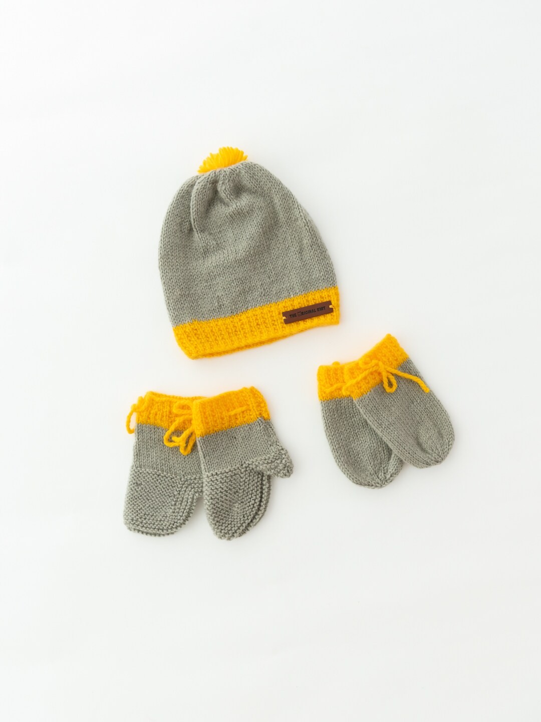

The Original Knit Kids Grey & Yellow Self Design Acrylic Beanie Cap With Socks & Mittens