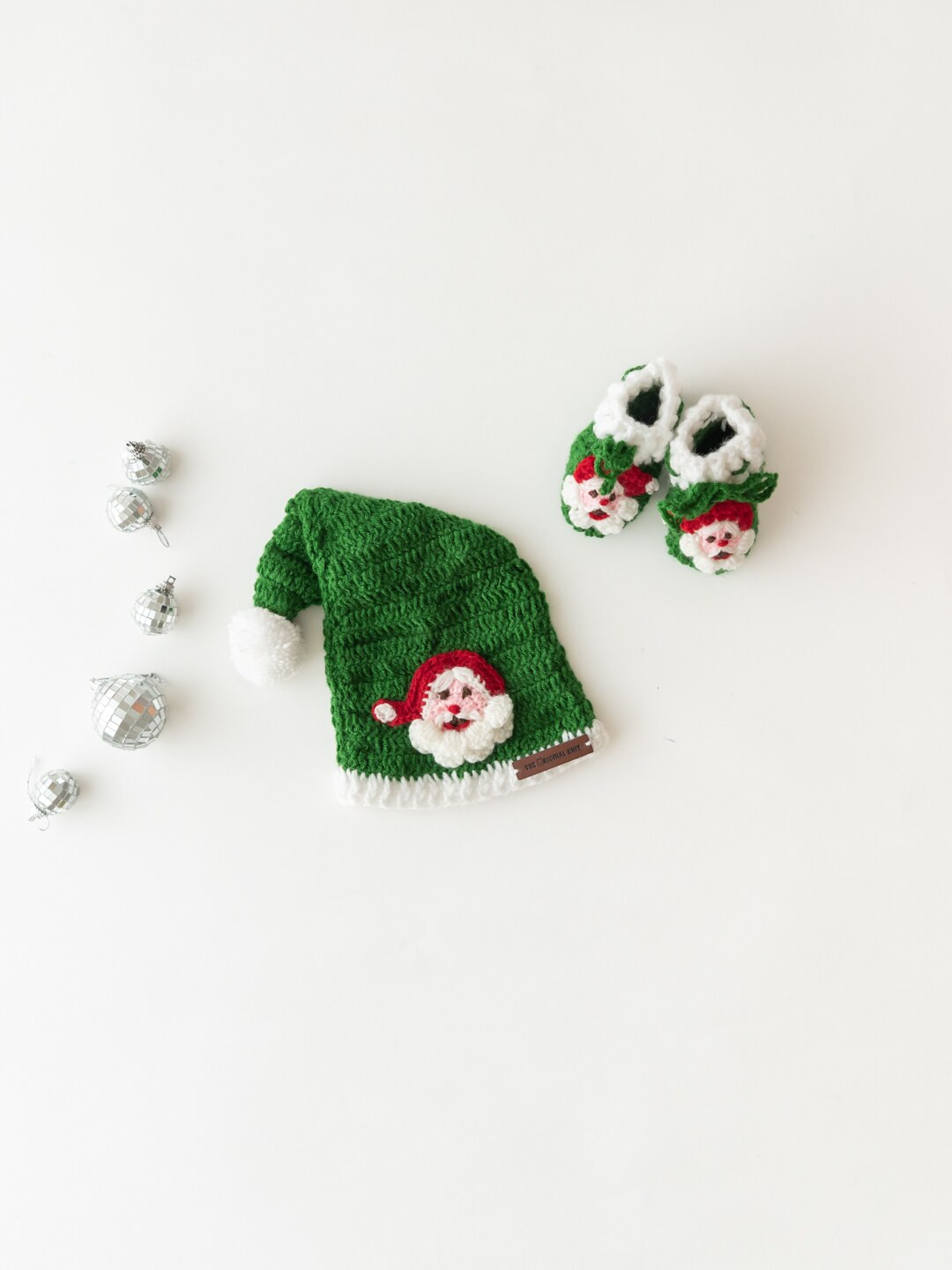 

The Original Knit Kids Green & White Acrylic Self Design Santa Cap With Booties