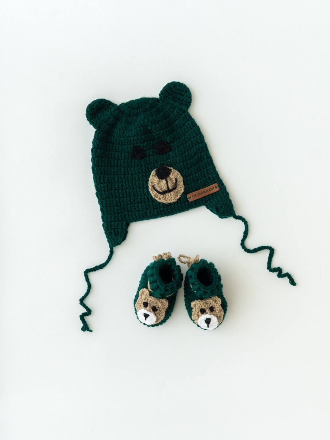 

The Original Knit Kids Green & Brown Self Design Acrylic Beanie Teddy Cap With Booties