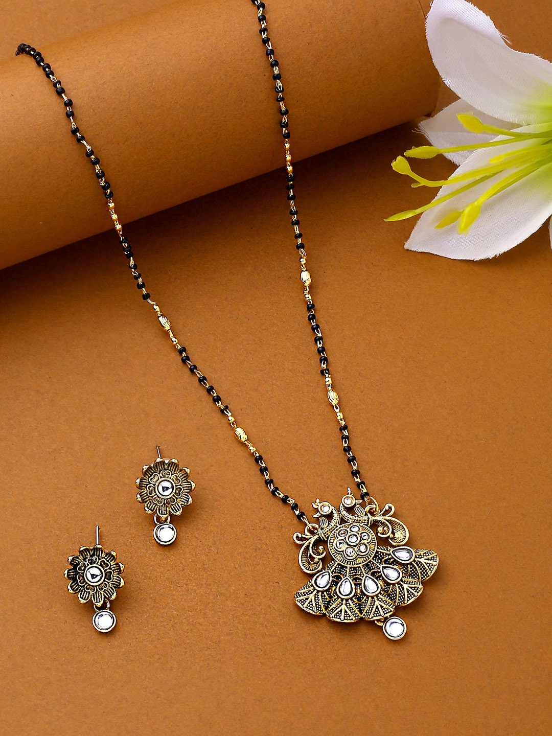 

Yellow Chimes Women Black Gold-Plated Peacock Design Beads Mangalsutra With Earrings