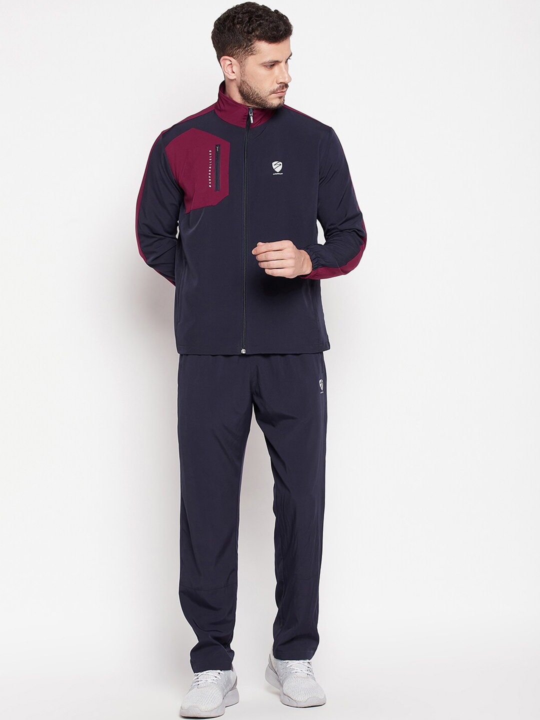 

UNPAR Men Navy Blue & Red Colourblocked Tracksuits