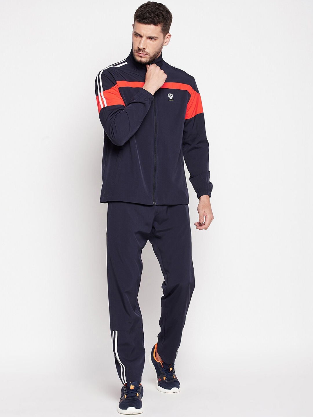 

UNPAR Men Navy Blue & Red Solid Tracksuits