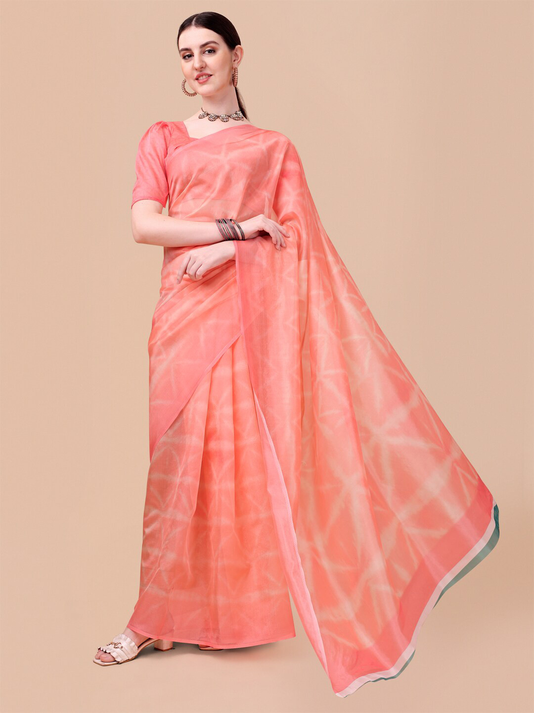 

Sangria Peach Printed Organza Saree