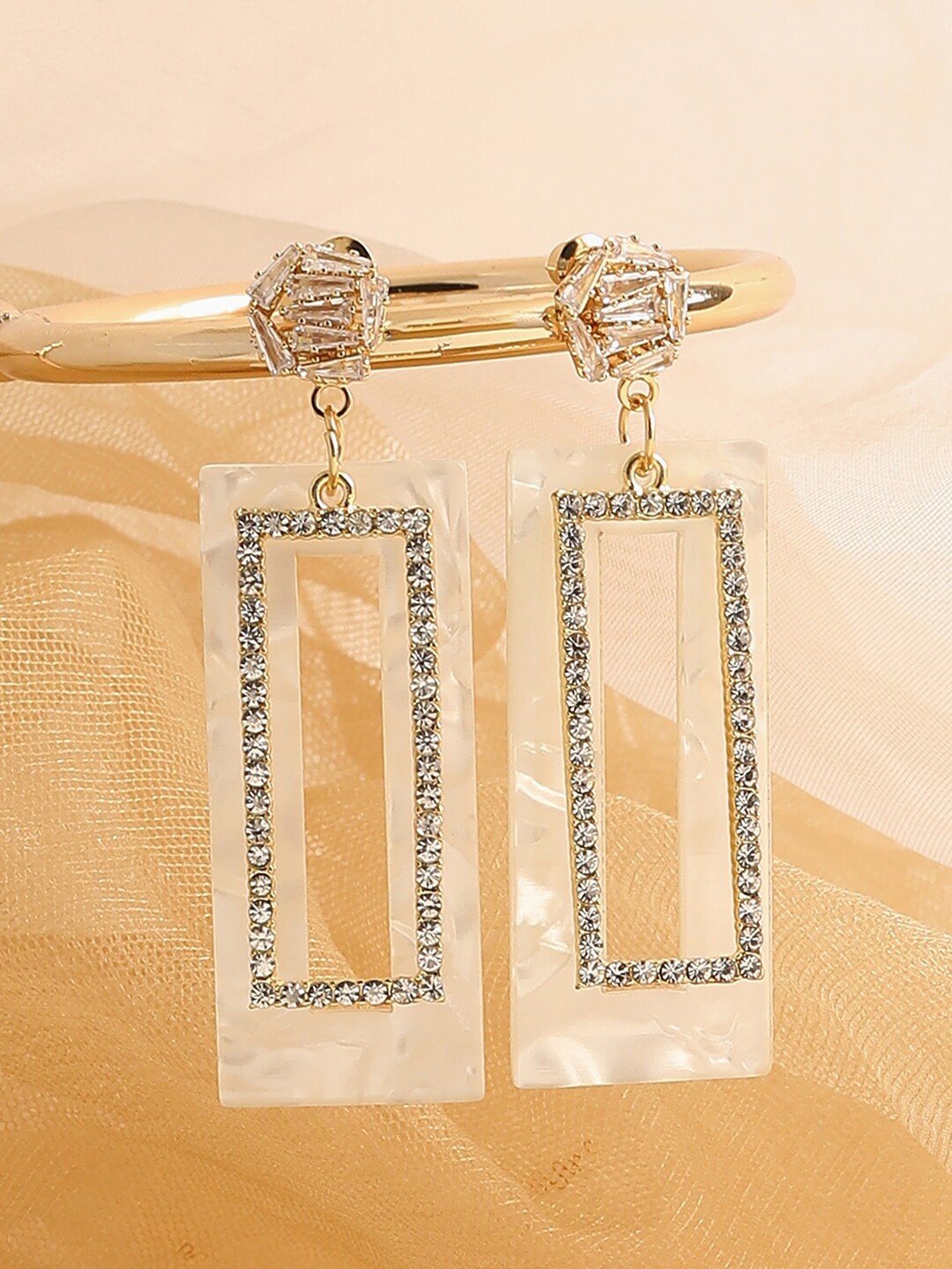 

SOHI White Contemporary Gold-Plated Drop Earrings