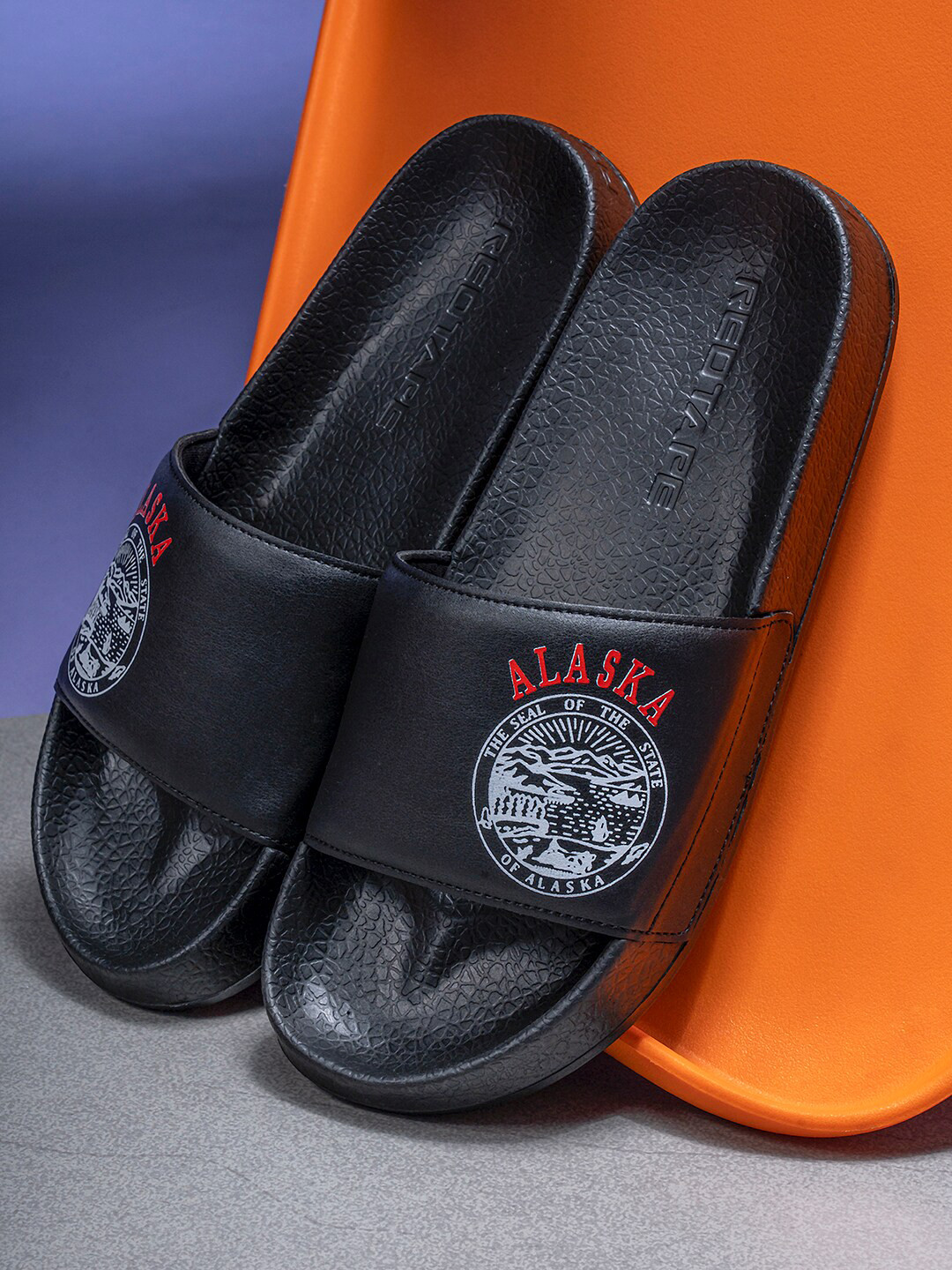 

Red Tape Men Black & White Printed Rubber Sliders