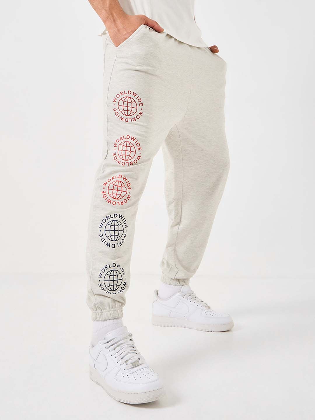 

Styli Men Worldwide Placement Print Oversized Joggers, Cream