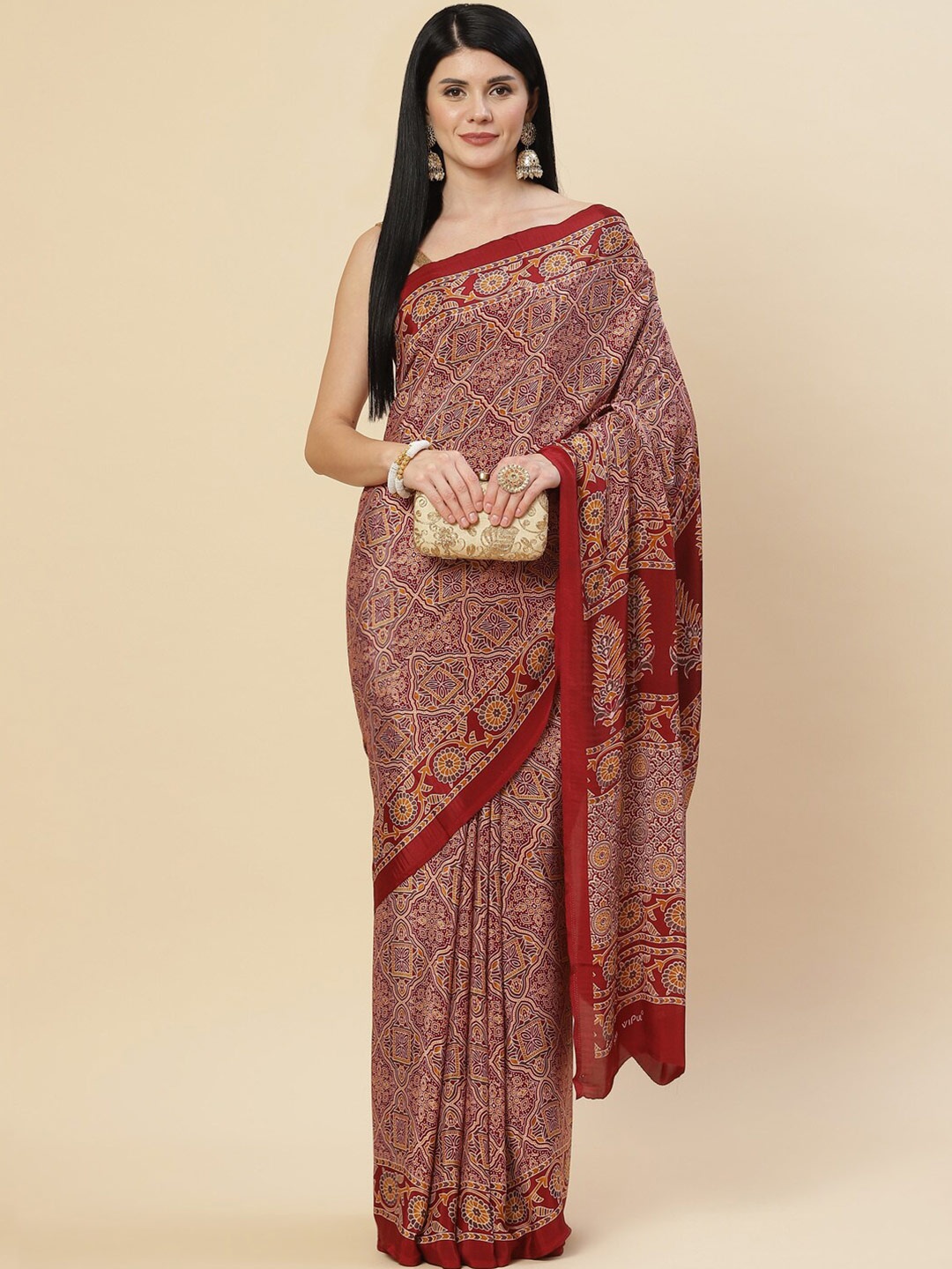 

Meena Bazaar Maroon & Orange Ethnic Motifs Saree