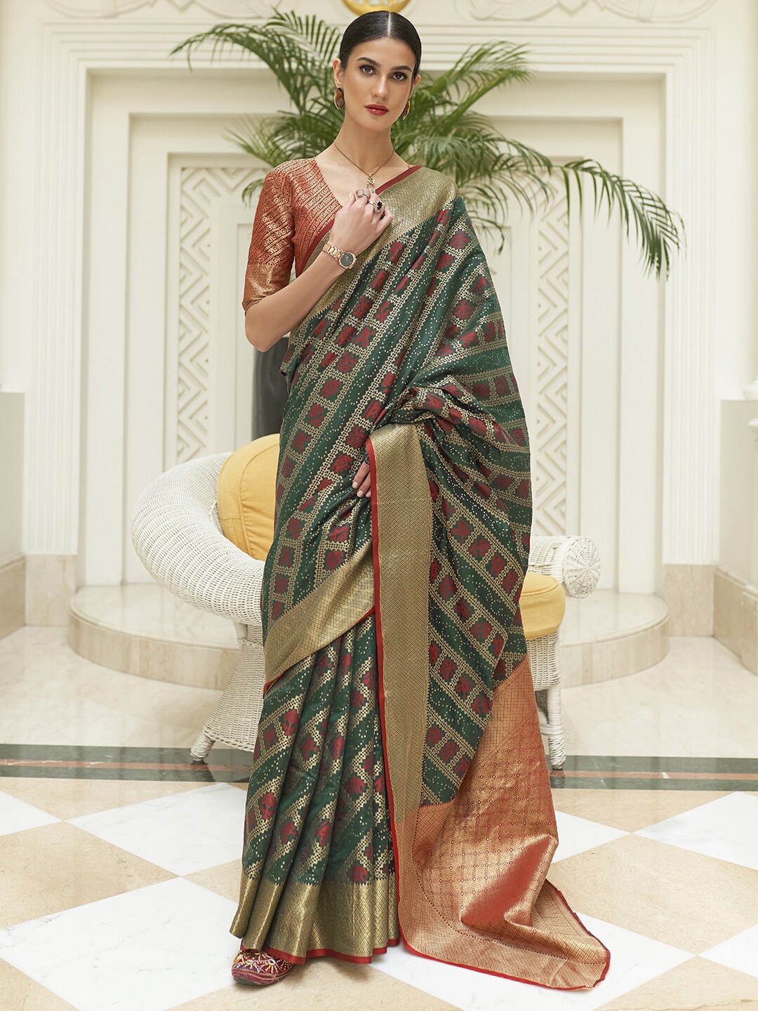 

Mitera Green & Red Ethnic Motifs Zari Patola Saree