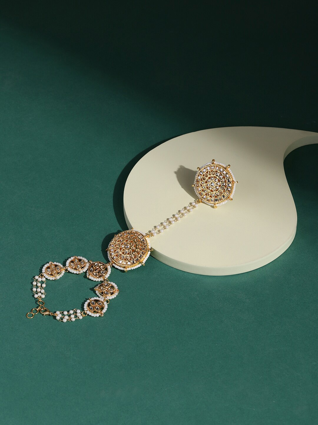 

Ruby Raang Women Gold-Toned & White Brass Kundan Gold-Plated Charm Bracelet