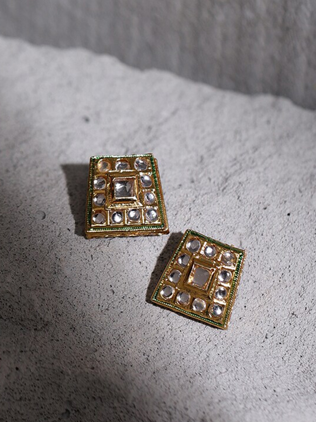 

Ruby Raang Gold-Toned & White Kundan Square Shaped Gold-Plated Studs Earrings