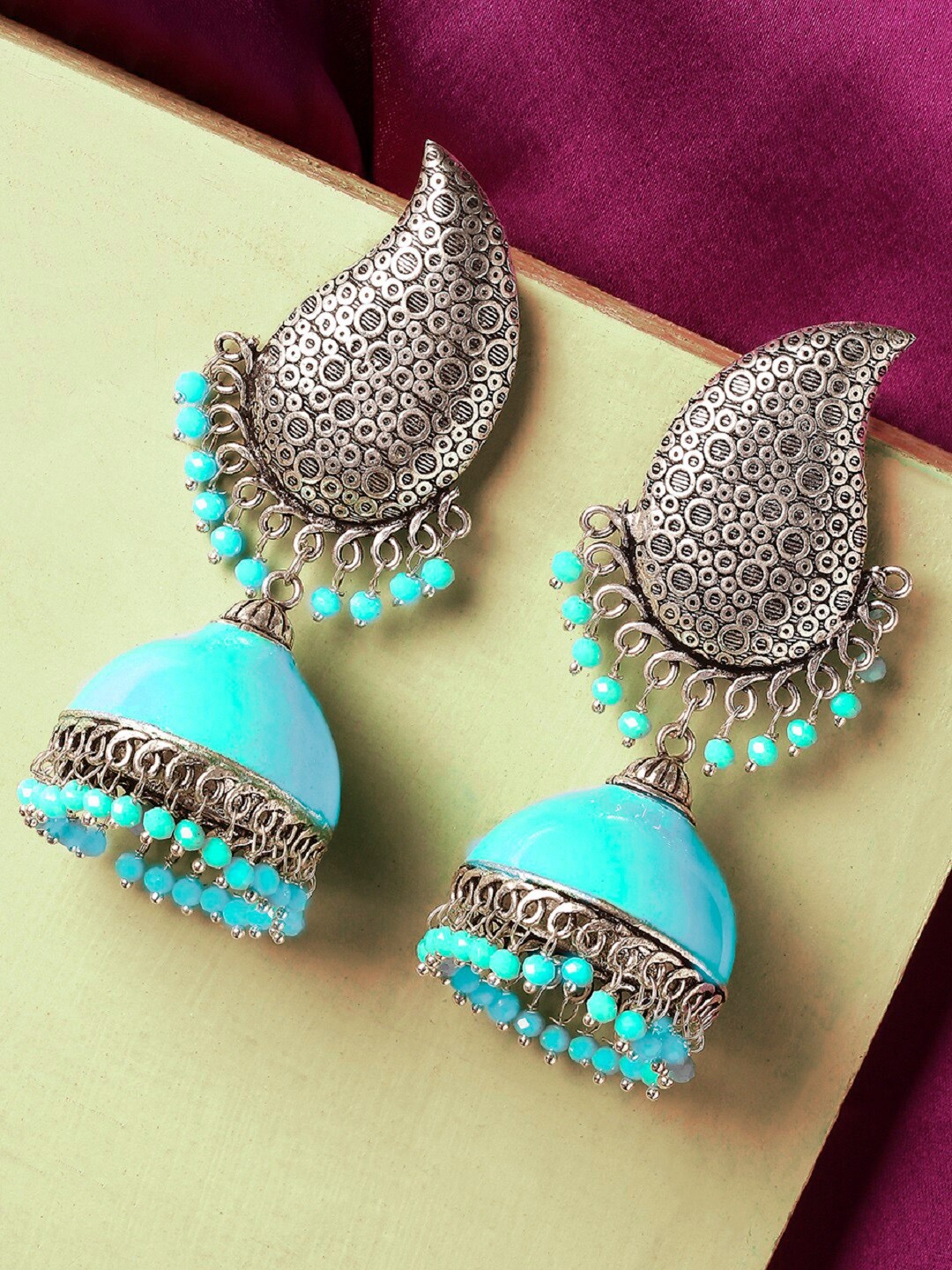 

OOMPH Blue & Silver-Toned Dome Shaped Jhumkas Earrings