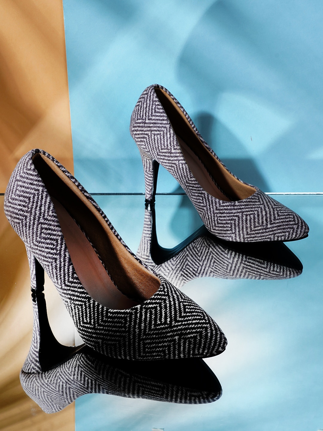 

Get Glamr Black & White Textured Block Pumps