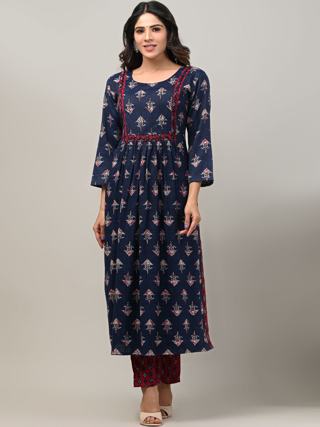 

DHRTI Women Navy Blue Floral Printed Pleated Kurta with Trousers