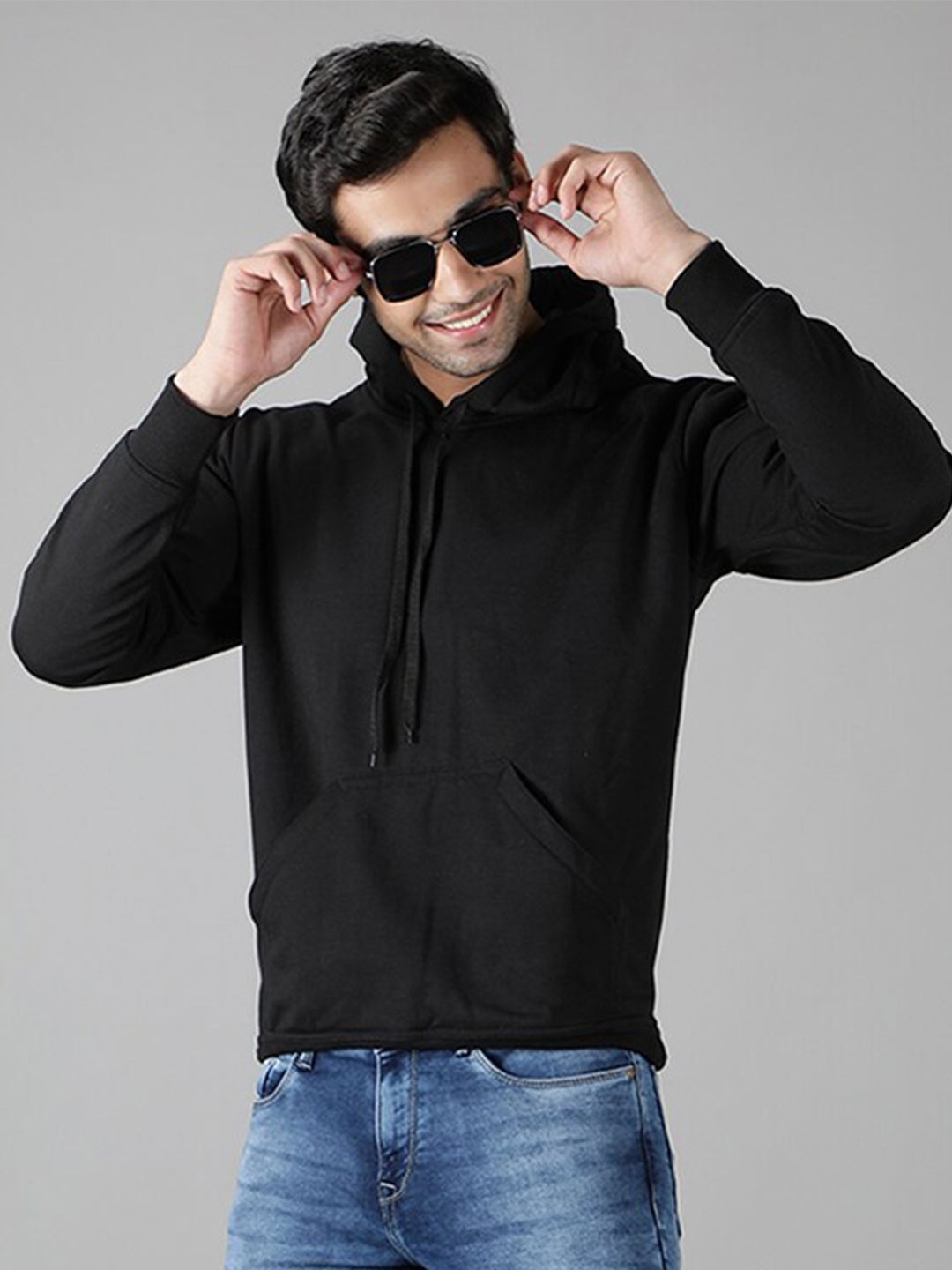 

Mad Over Print Men Black Solid Hooded Sweatshirt