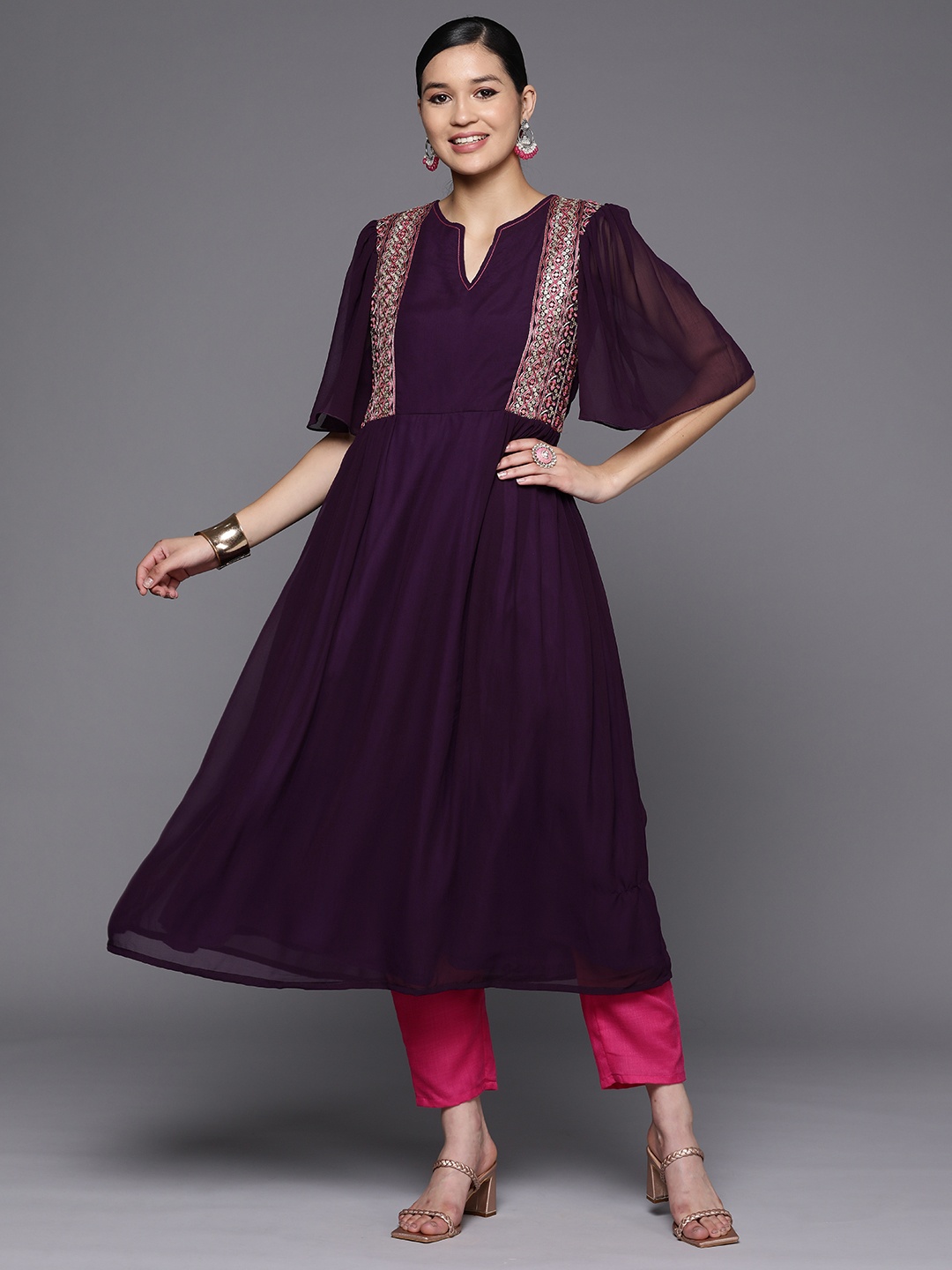 

Inddus Women Purple Ethnic Motifs Embroidered Pleated Thread Work Kurta with Trousers
