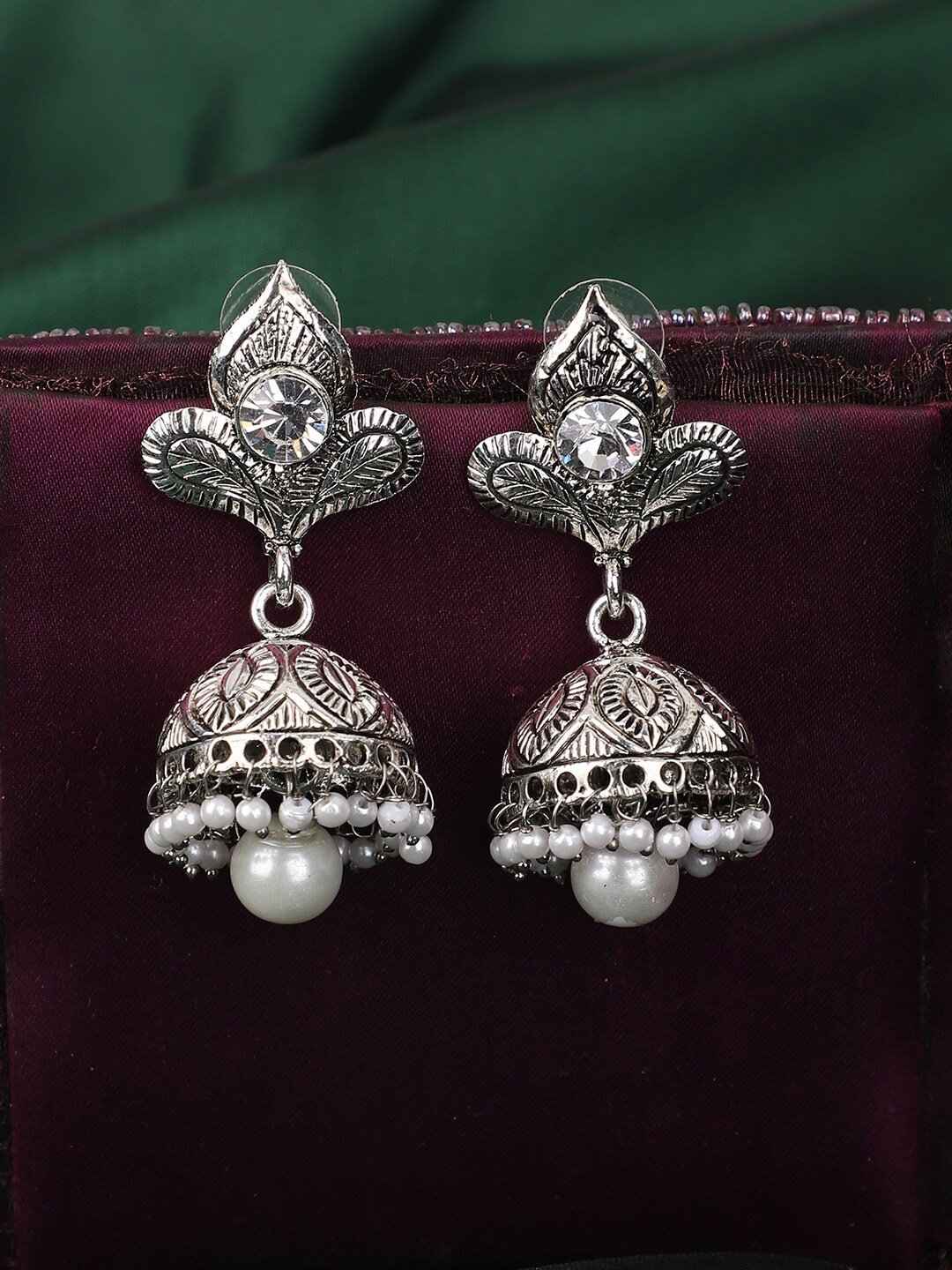 

ANIKAS CREATION Silver-Plated Contemporary Jhumkas Earrings