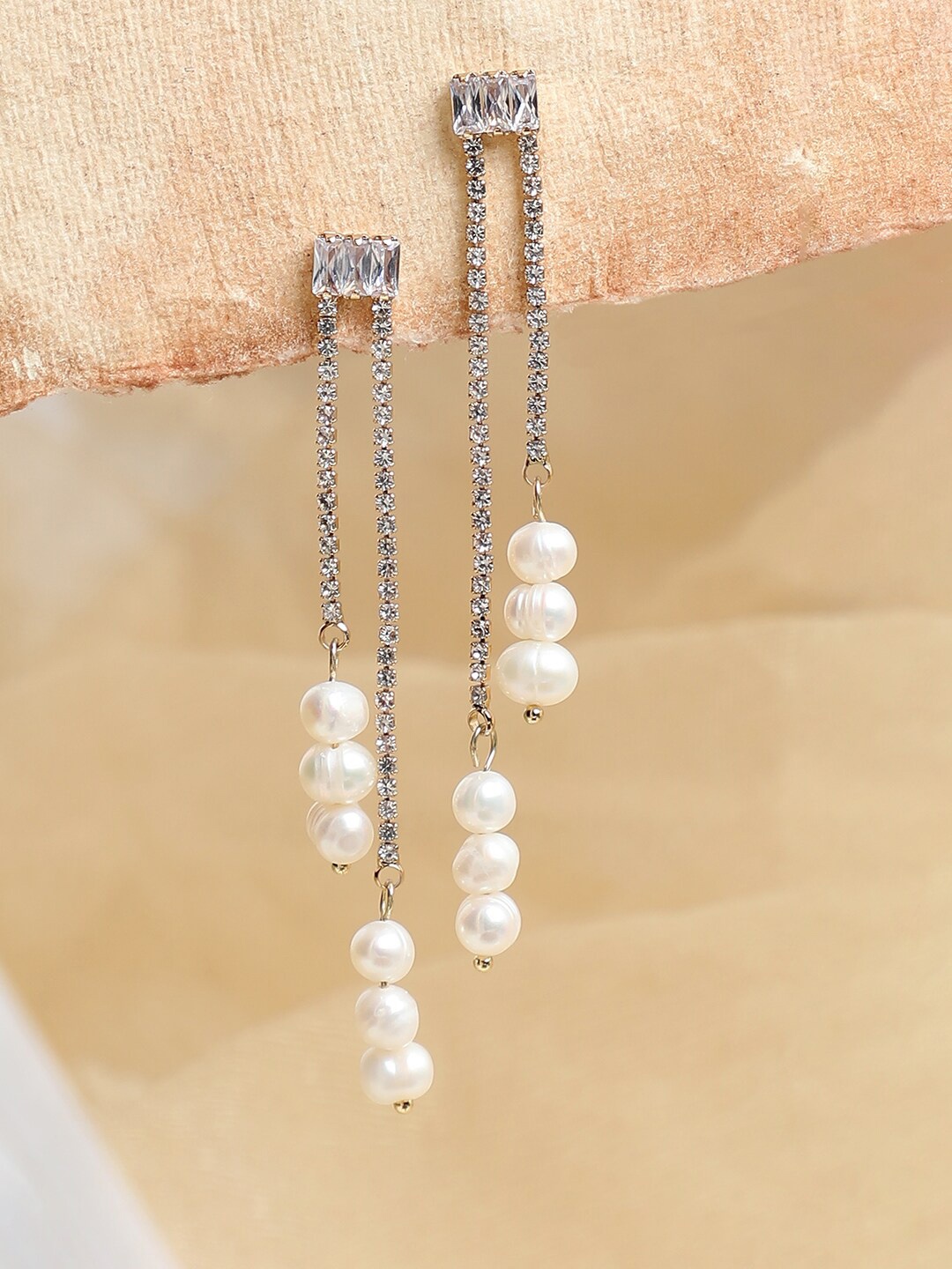 

SOHI Gold-Plated White Contemporary Drop Earrings