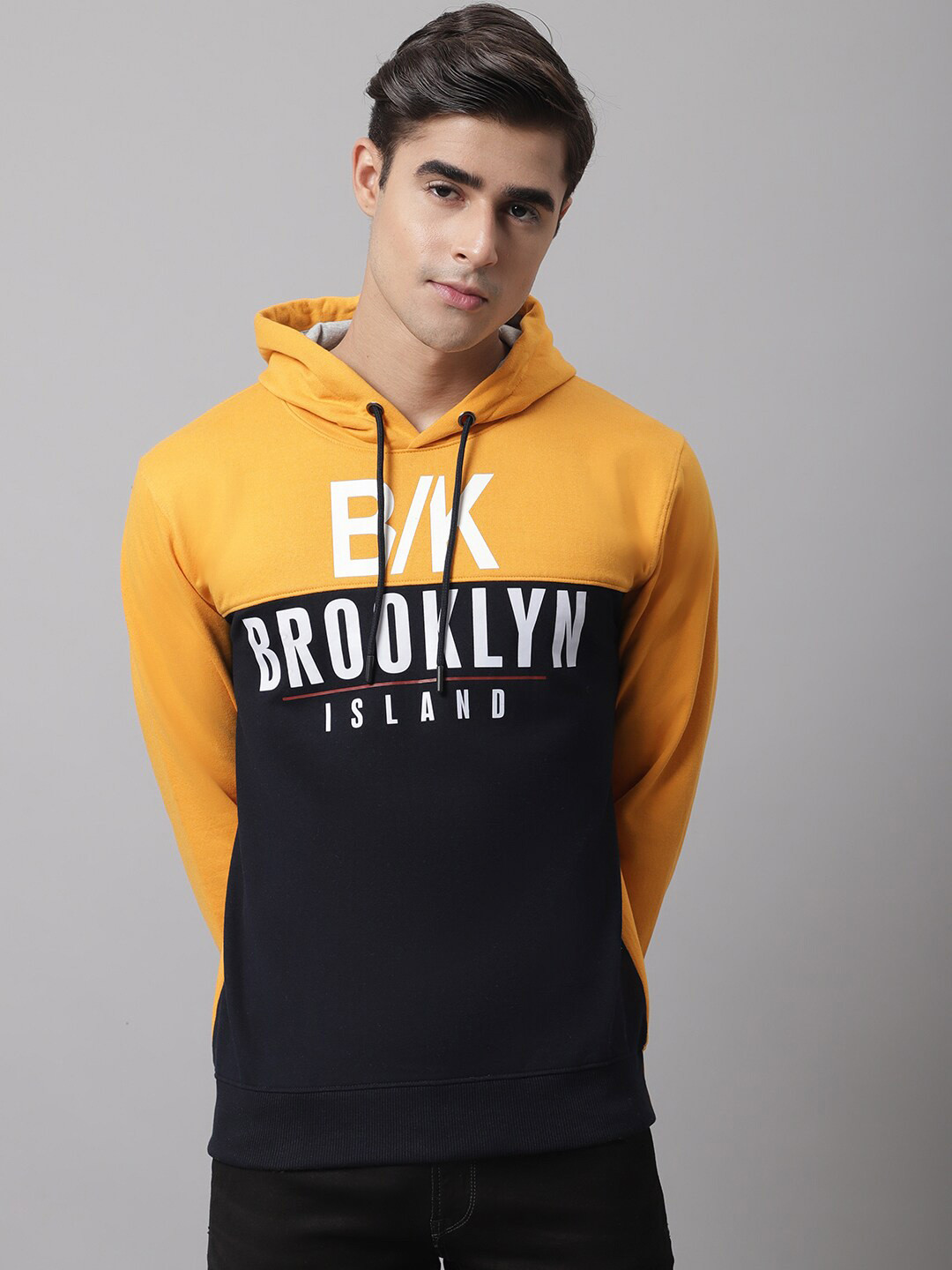 

Cantabil Men Mustard Colourblocked Hooded Sweatshirt
