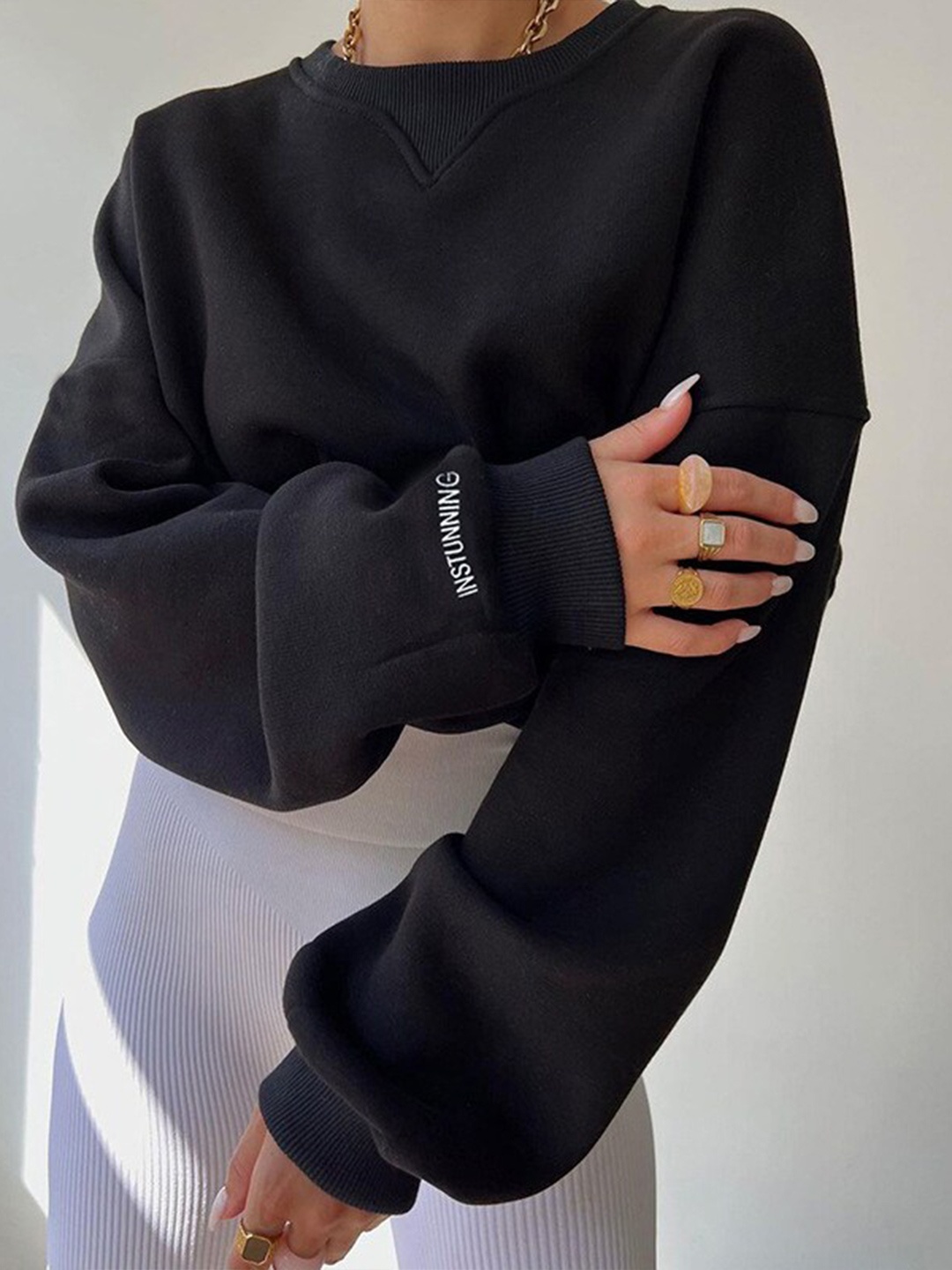 

BoStreet Women Black Solid Sweatshirt