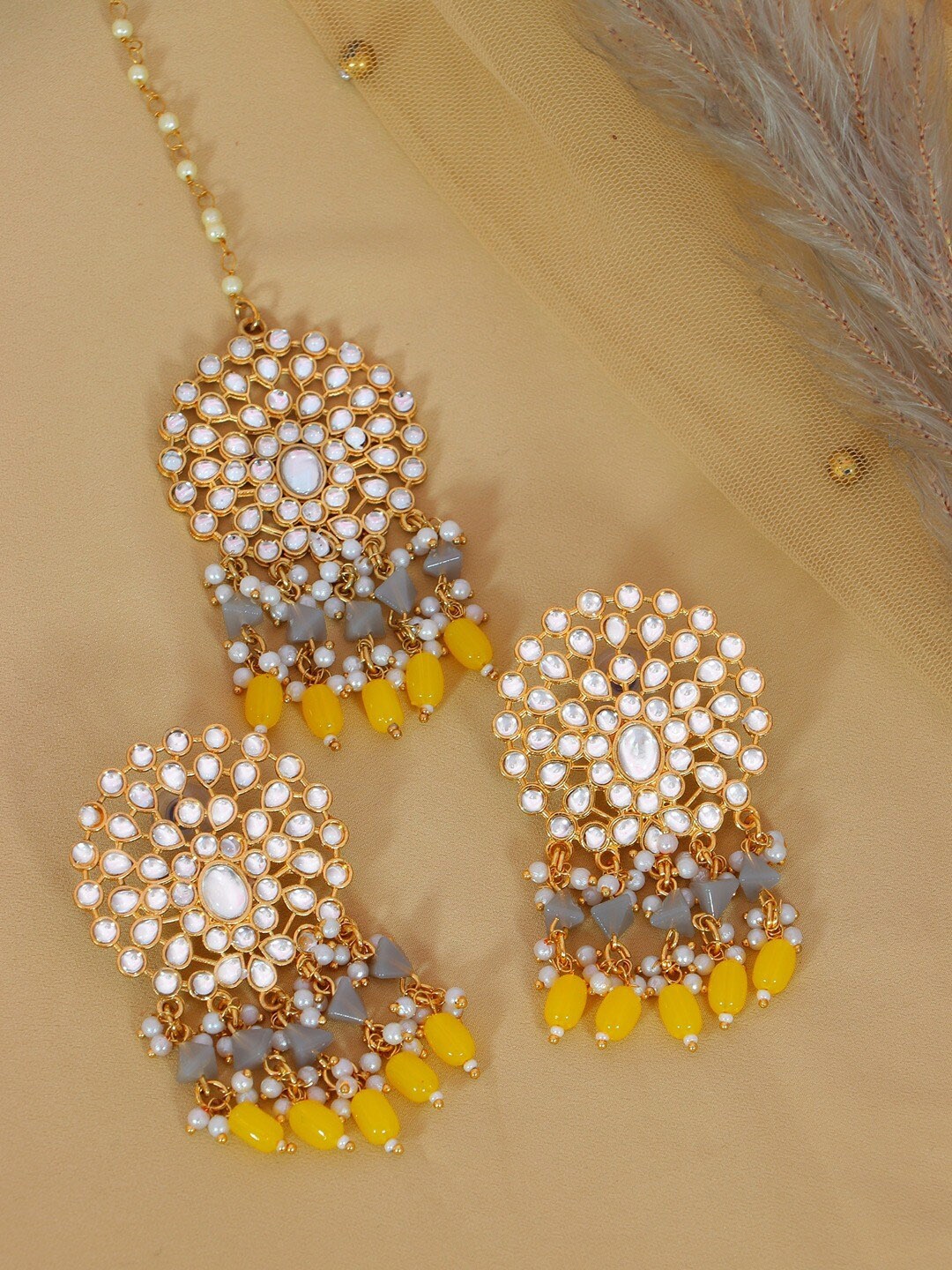 

Crunchy Fashion Women White & Yellow Gold-Plated Kundan Maang Tika and Earrings
