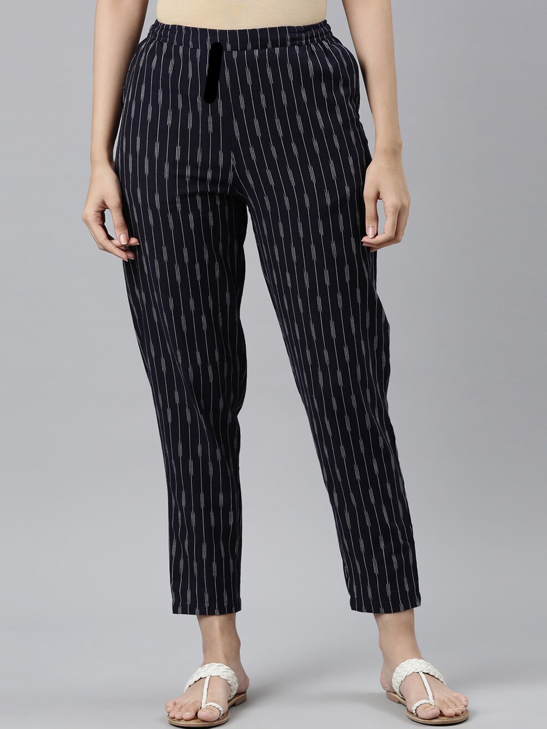 

Go Colors Women Navy Blue Striped Tailored Tapered Fit Pleated Trousers