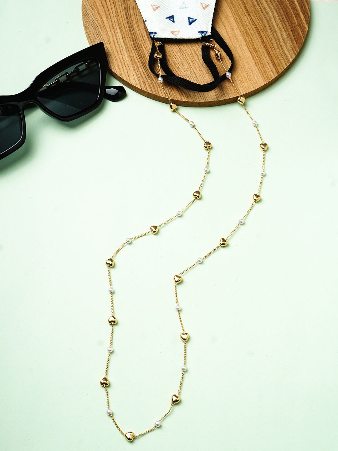 

Ferosh Women Gold-Toned & White Artificial Beads & Heart Beaded Mask Chains