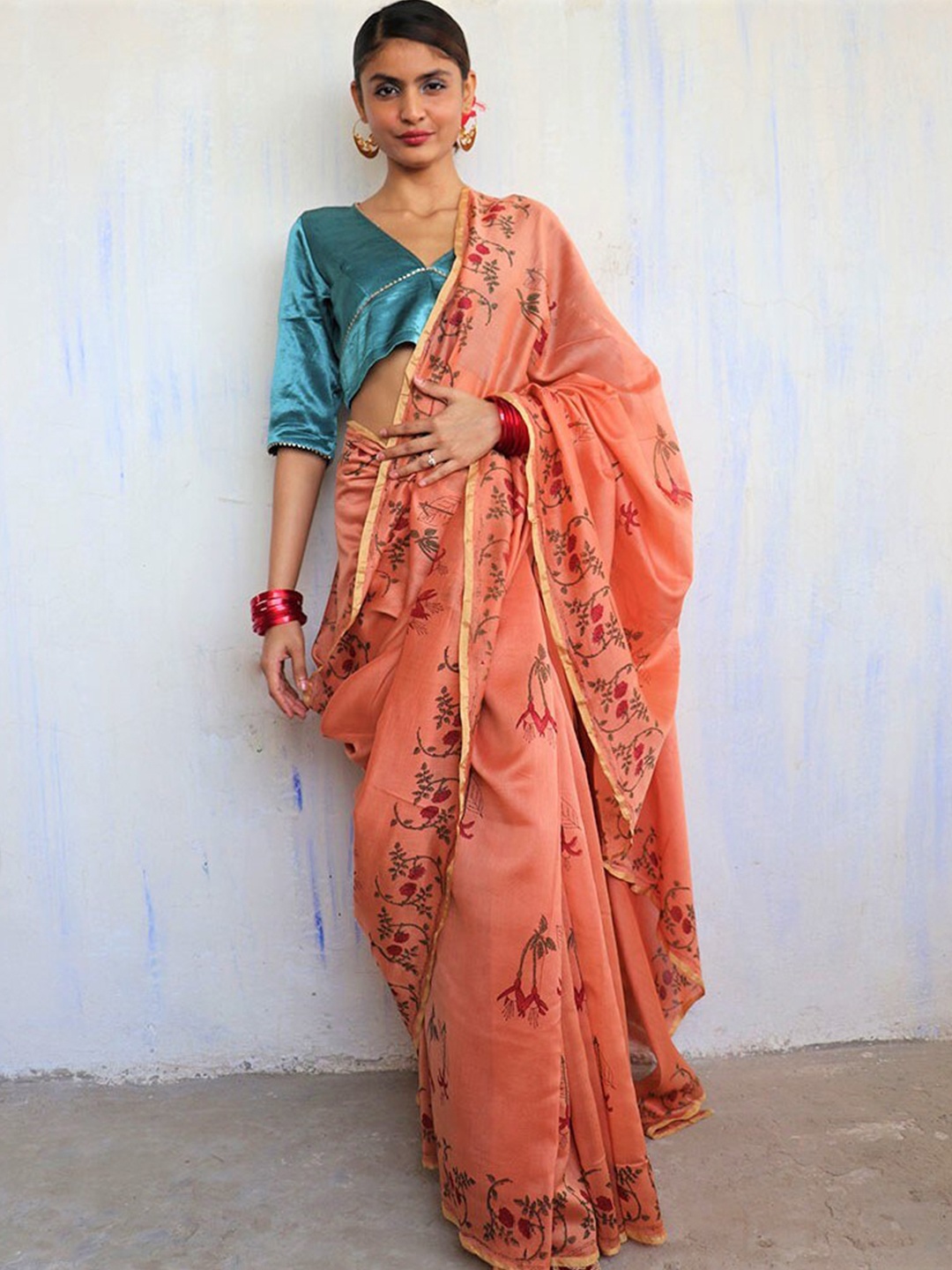 

Chidiyaa Orange & Red Floral Printed Zari Pure Silk Chanderi Saree
