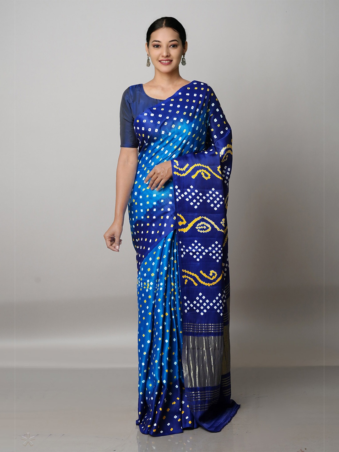 

Unnati Silks Blue & White Bandhani Printed Zari Saree