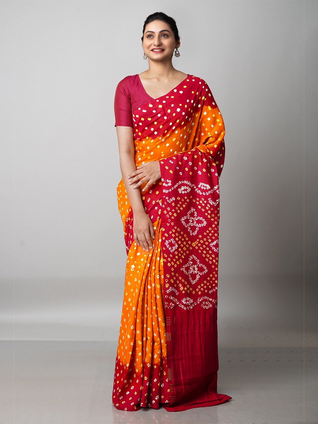 

Unnati Silks Orange & Red Bandhani Silk Blend Bandhani Saree