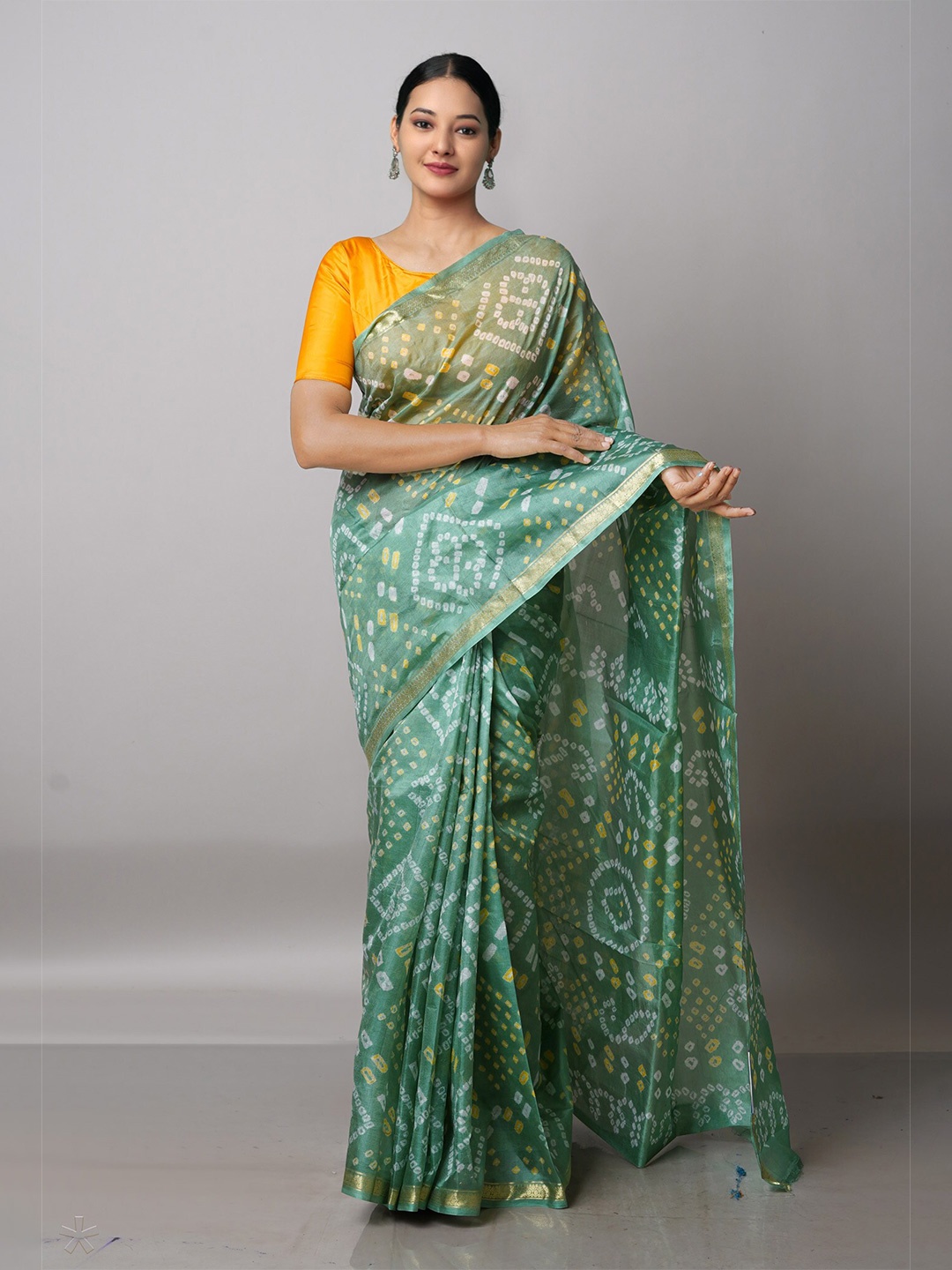 

Unnati Silks Green & White Bandhani Zari Silk Blend Bandhani Saree