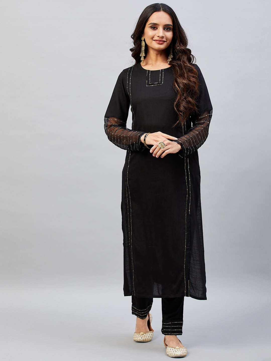 

Aaheli Women Black Embroidered Mukaish Kurta with Trousers