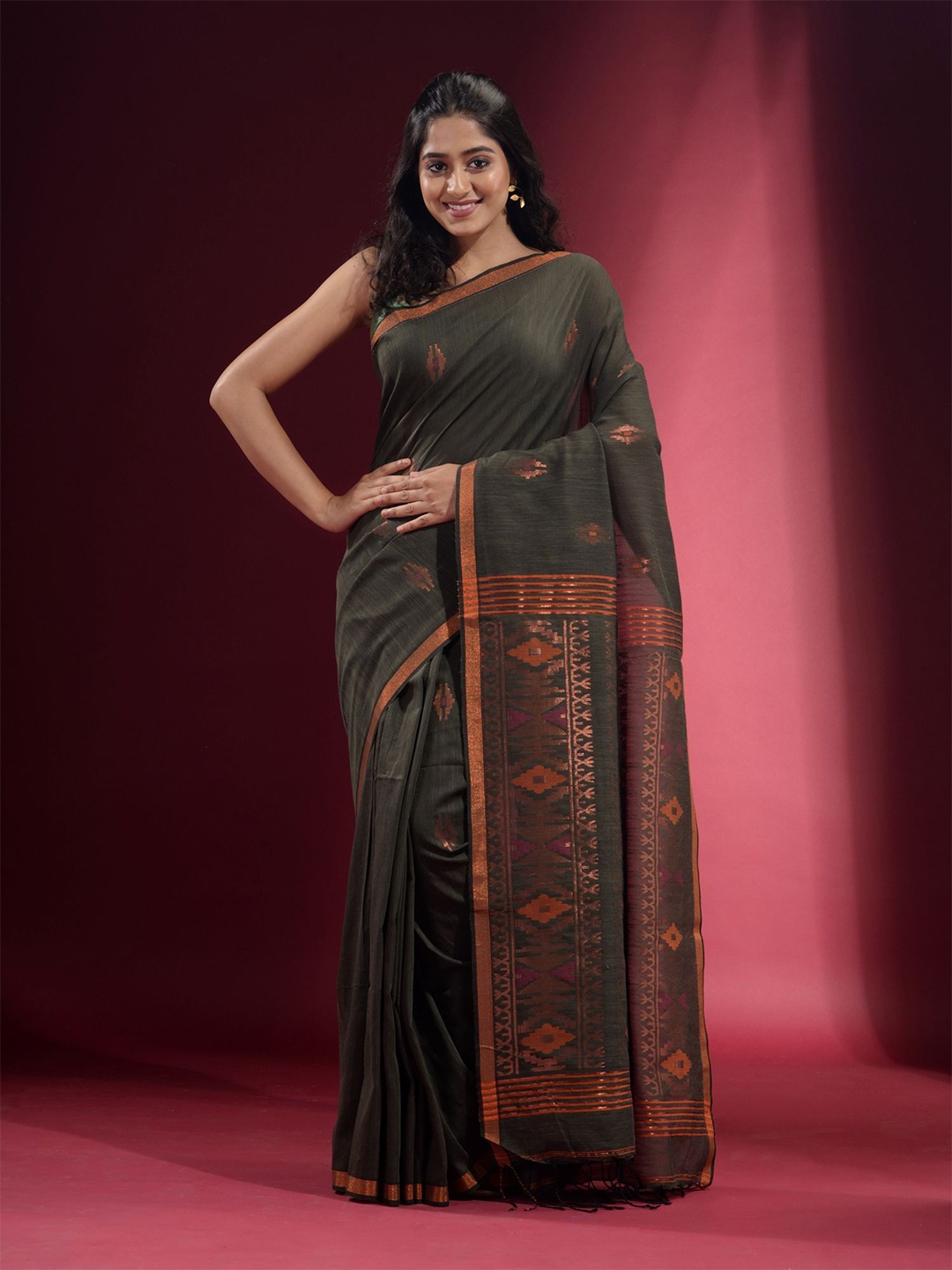 

Charukriti Green & Copper-Toned Woven Design Zari Pure Cotton Saree