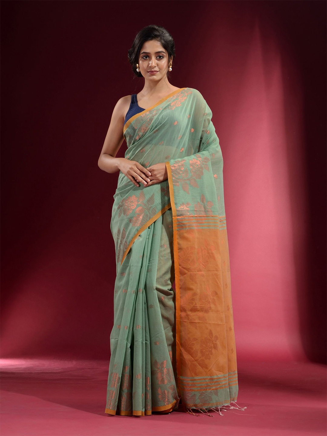

Charukriti Green & Copper-Toned Woven Design Zari Pure Cotton Saree