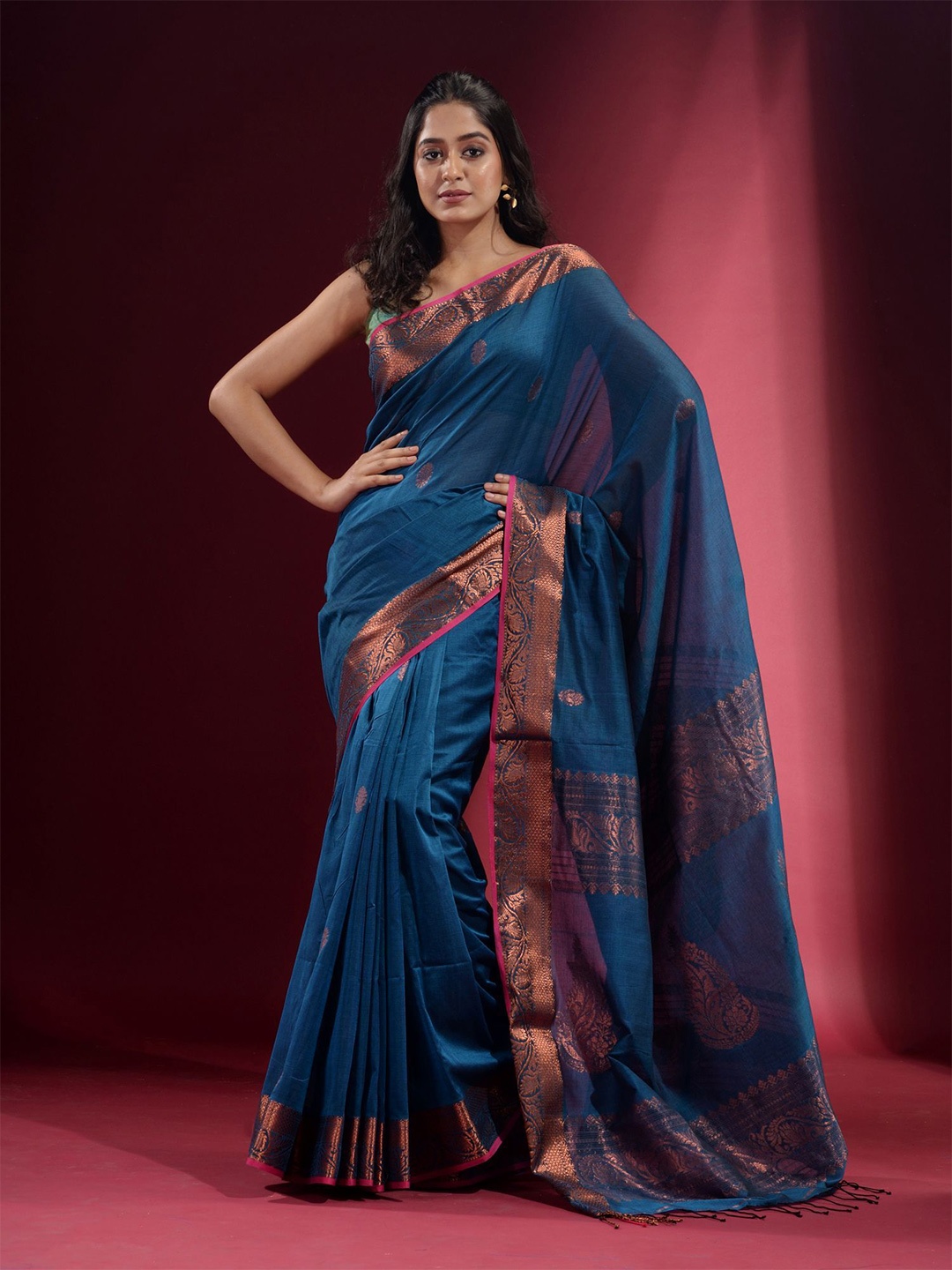 

Charukriti Blue & Copper-Toned Woven Design Zari Pure Cotton Saree