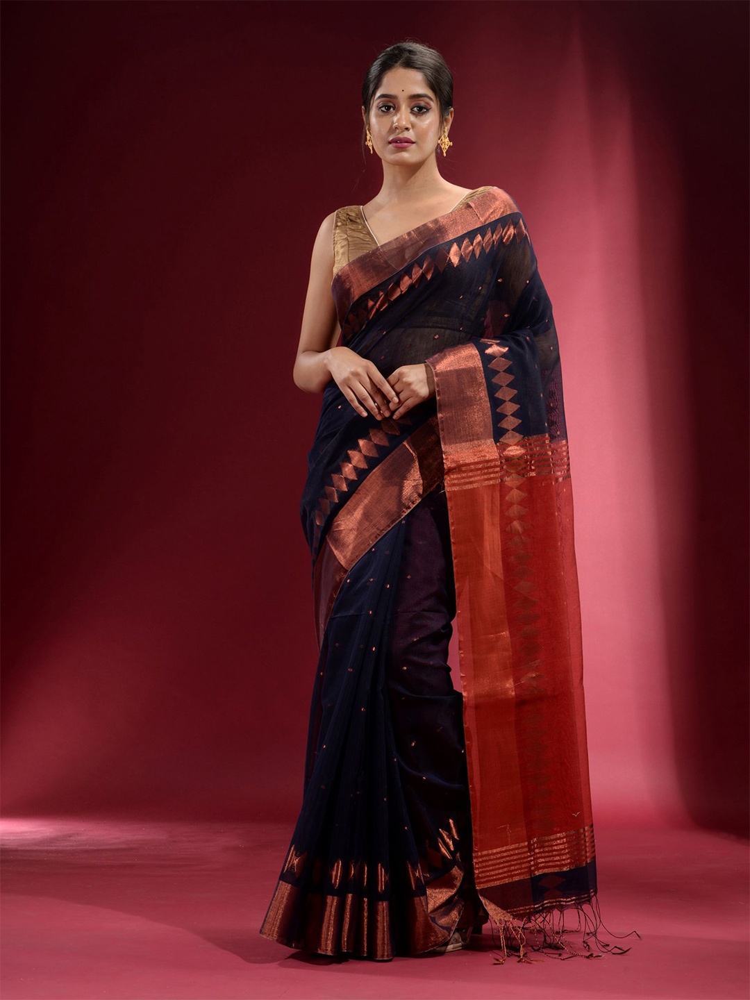 

Charukriti Women Navy Blue & Copper-Toned Zari Saree