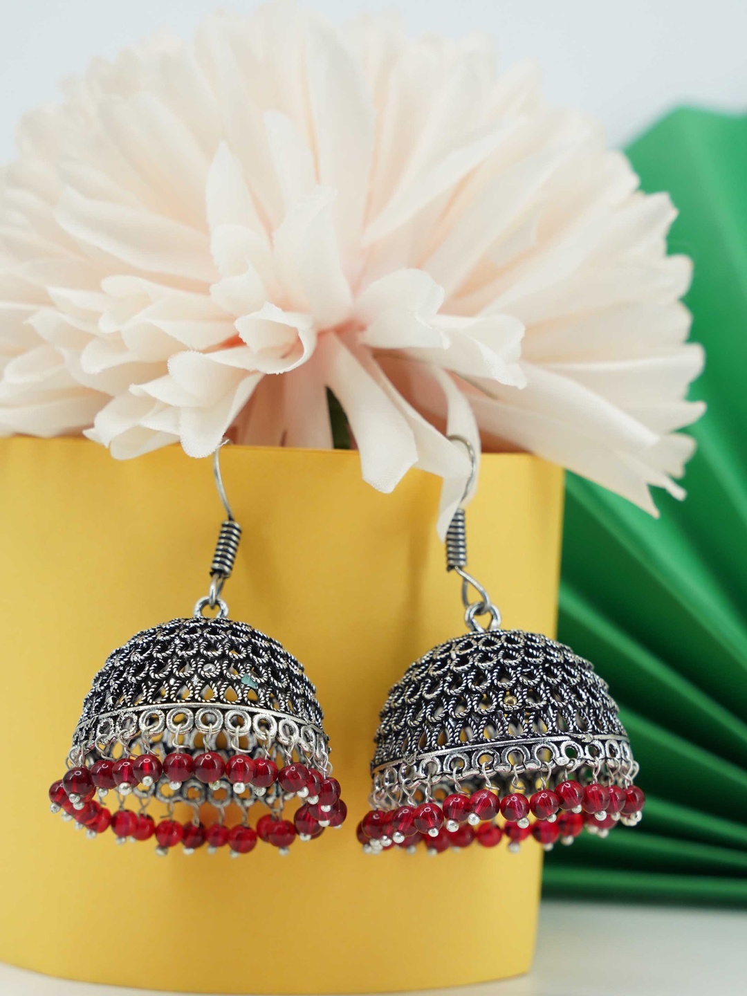

GRIIHAM Silver-Toned & Red Oxidised Dome Shaped Jhumkas Earrings