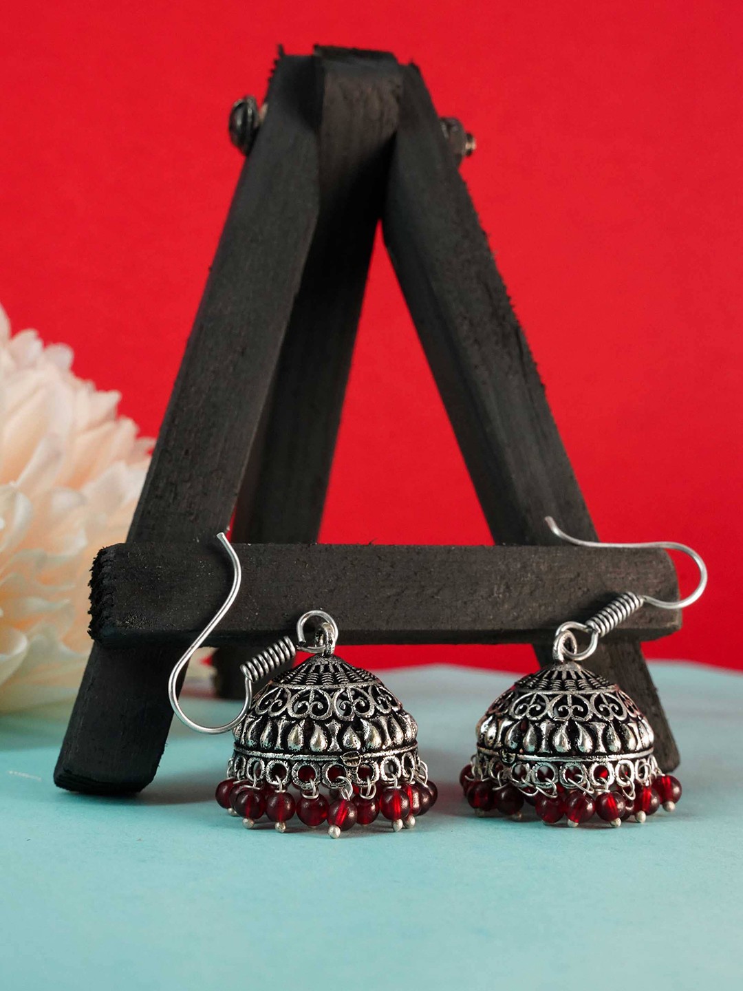 

GRIIHAM Red & Silver-Toned Oxidised Dome Shaped Jhumkas Earrings