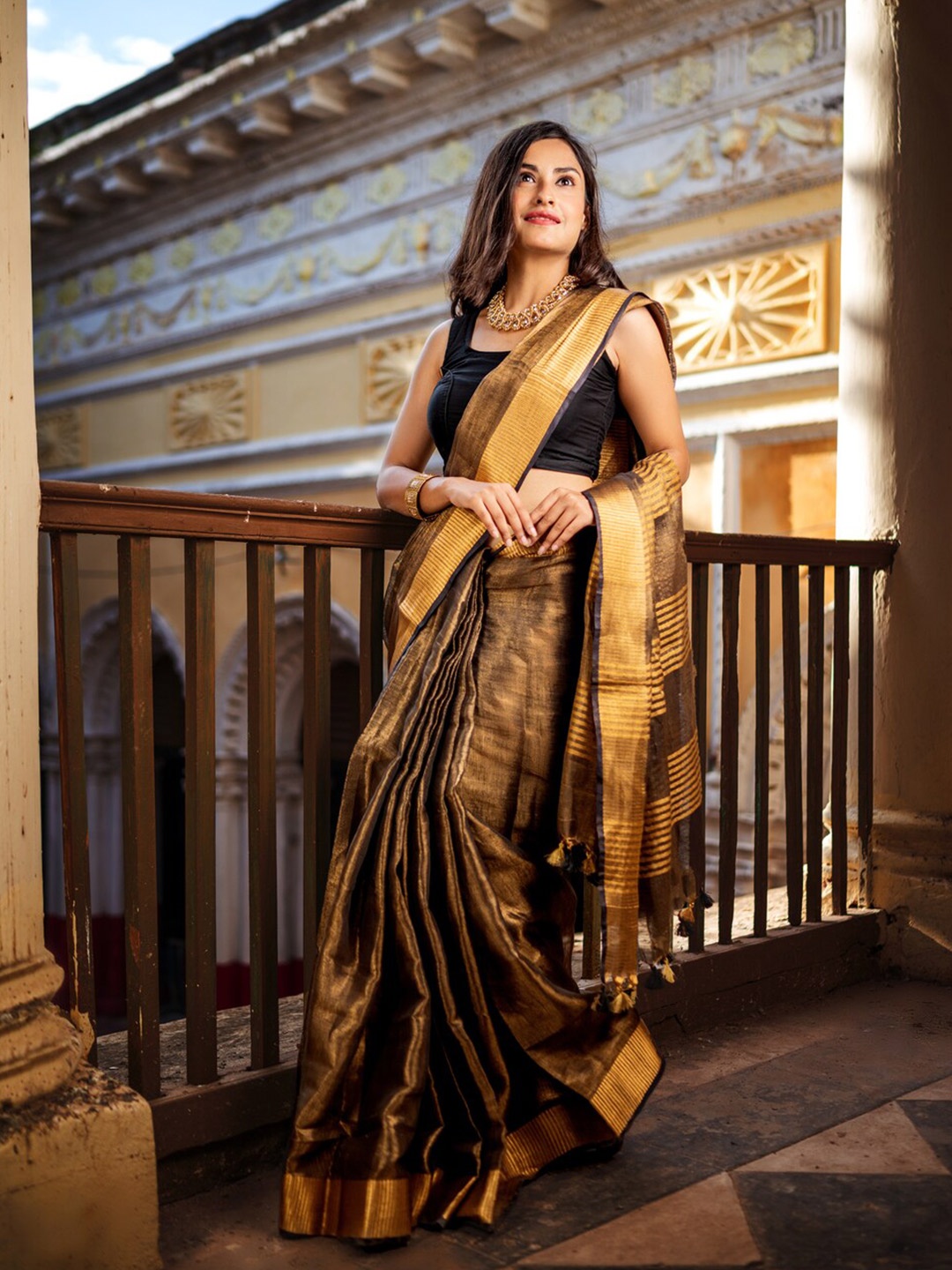 

Apaapi Threads of glory Black & Gold-Toned Woven Design Zari Tissue Saree
