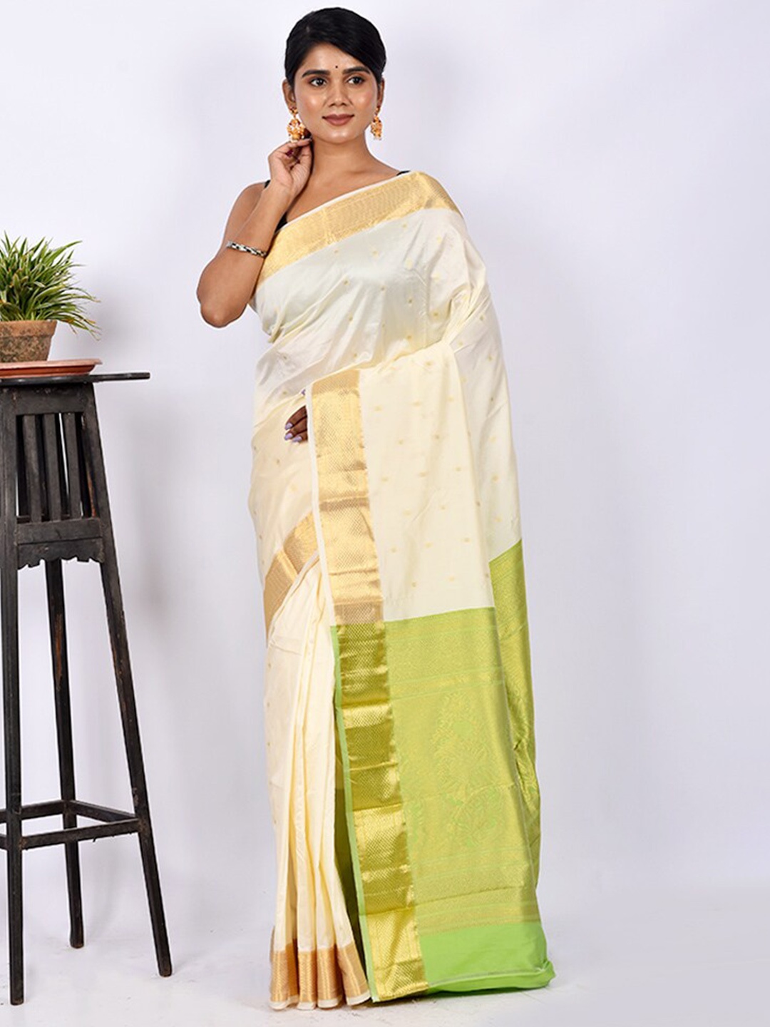 

AllSilks White & Green Ethnic Motif Zari Silk Blend Kanjeevaram Saree