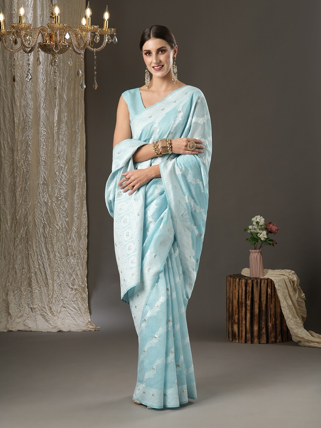 

Mitera Turquoise Blue & Silver-Toned Ethnic Motifs Zari Silk Cotton Banarasi Saree