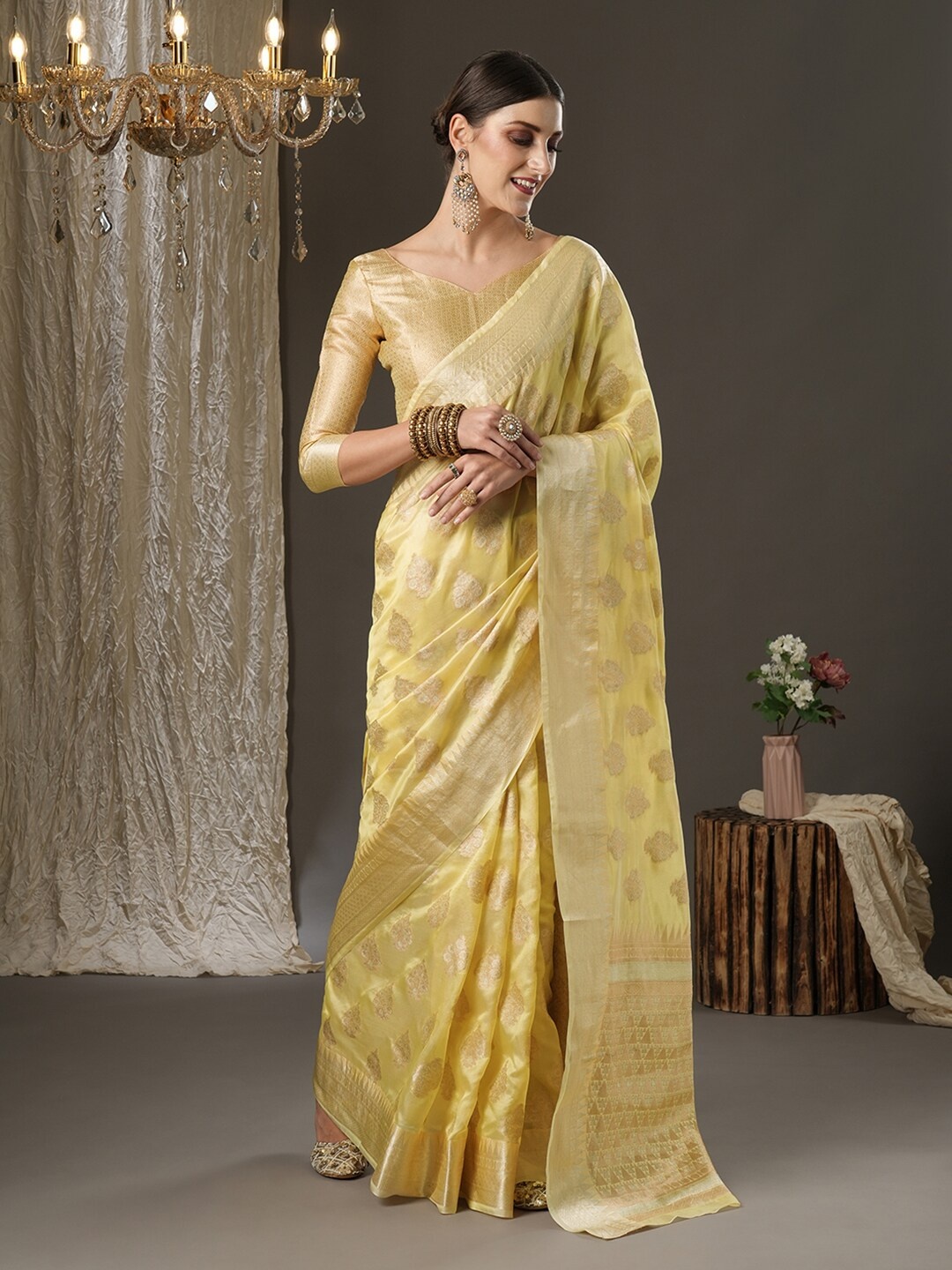 

Mitera Yellow & Gold-Toned Ethnic Motifs Zari Organza Dabu Saree