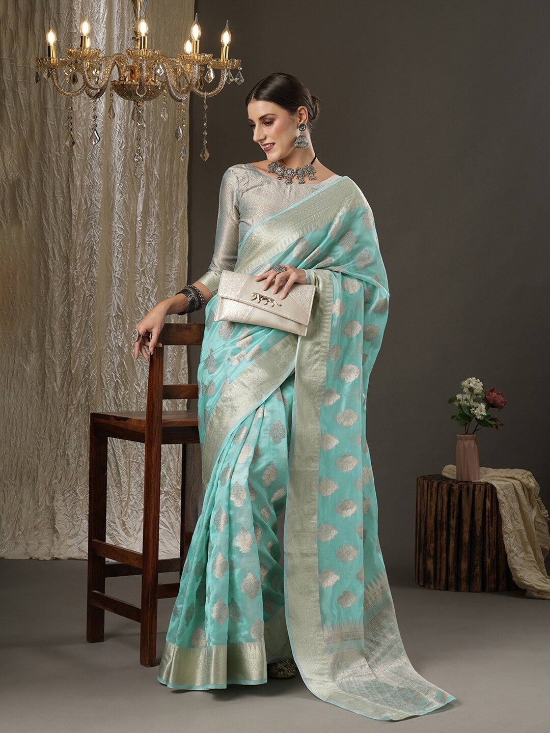 

Mitera Turquoise Blue & Silver-Toned Ethnic Motifs Zari Organza Dabu Saree