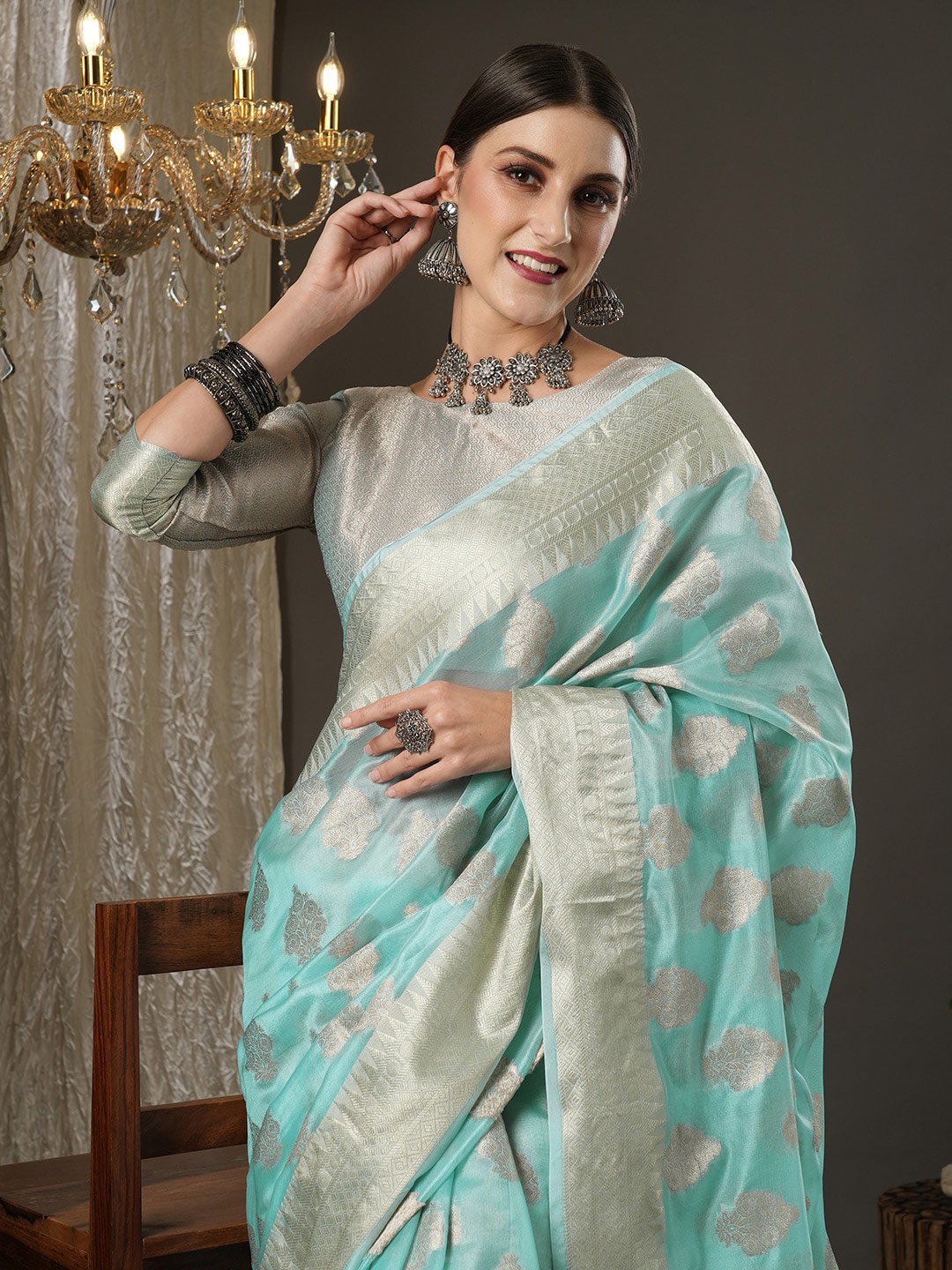 

Saree mall Turquoise Blue & Gold-Toned Woven Design Zari Organza Dabu Sarees