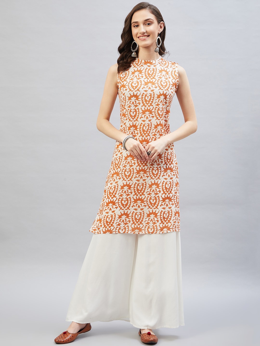 

InWeave Women Mustard Yellow Ethnic Motifs Printed Kurta with Palazzos