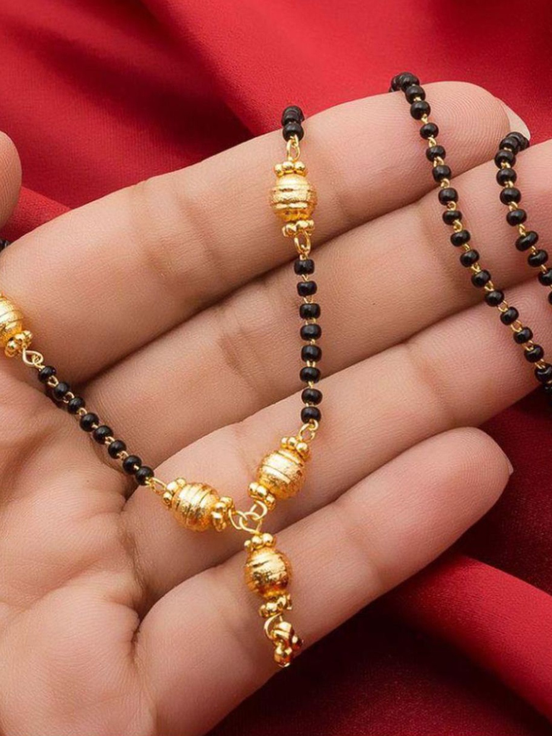 

Jewar Mandi Women Gold-Plated Black Crystal-Studded & Beaded Mangalsutra