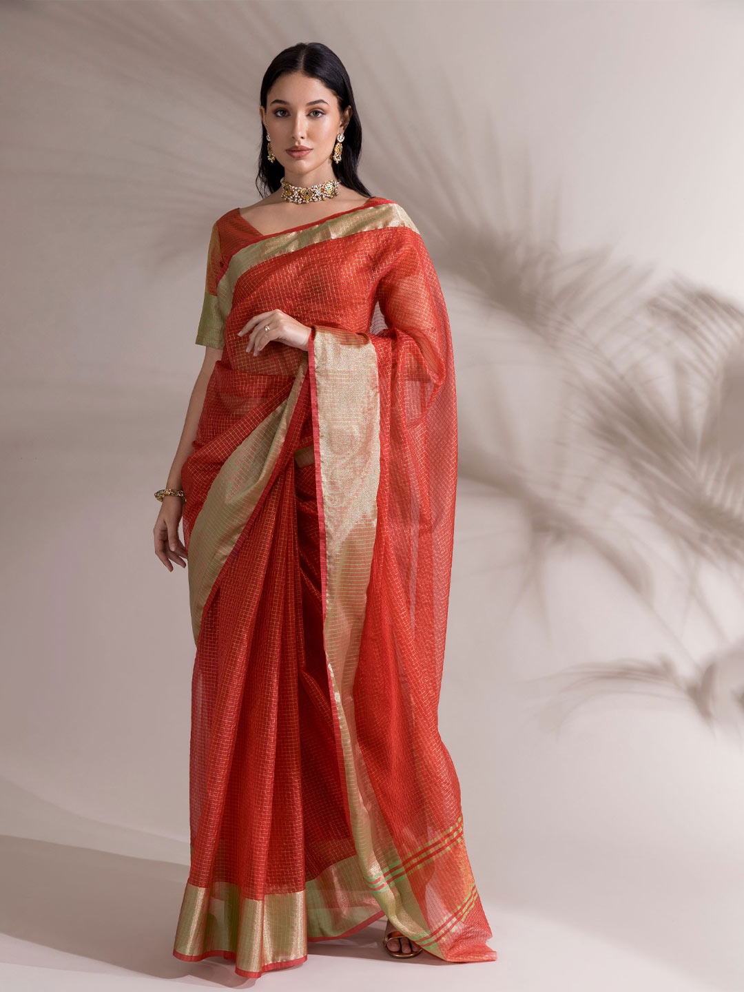 

Saaki Orange Woven Design Zari Banarasi Saree