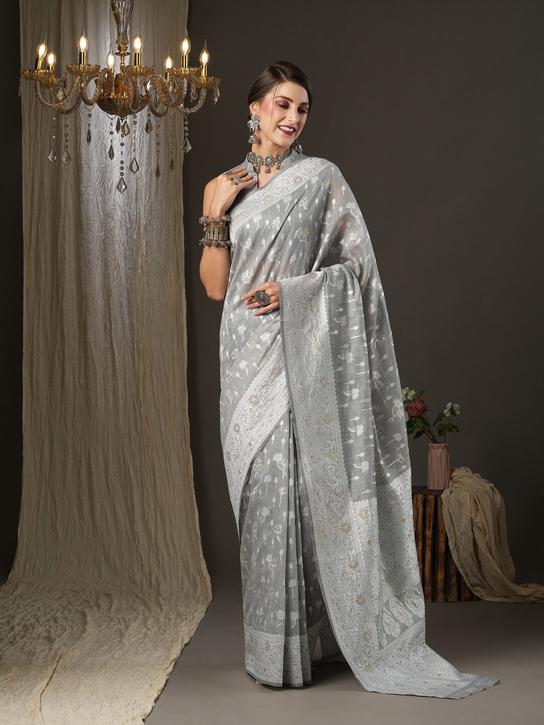 

Mitera Grey & Silver-Toned Ethnic Motifs Zari Silk Cotton Muga Saree