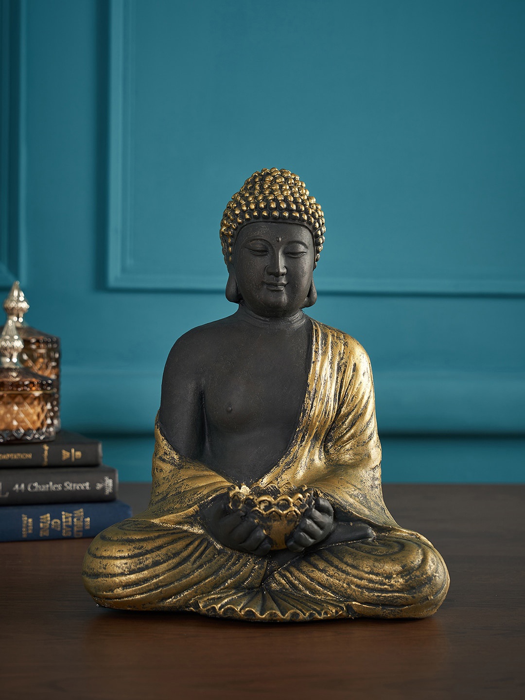 

Pure Home and Living Black & Gold-Toned Sitting Buddha With Tealight Showpiece