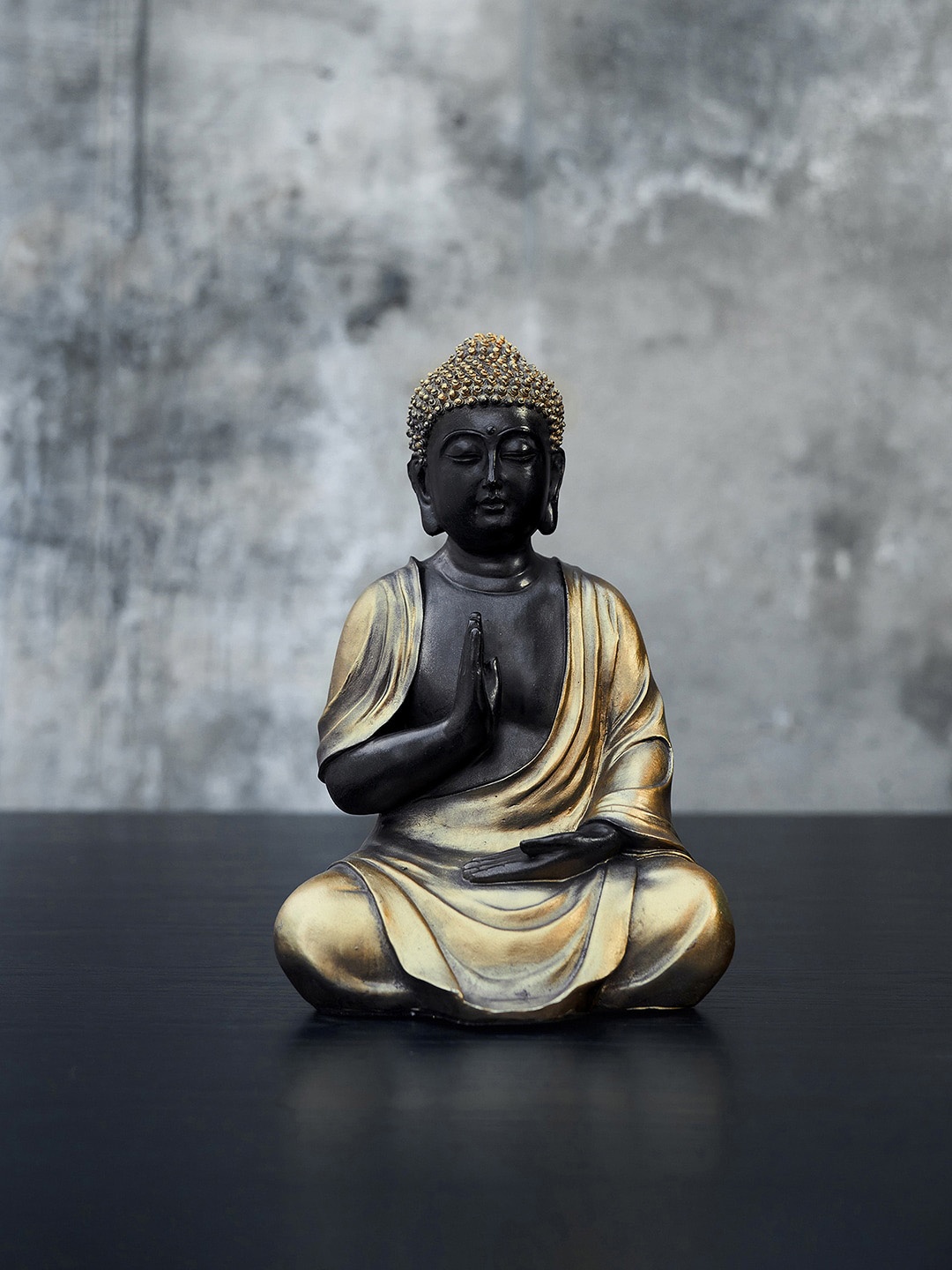 

Pure Home and Living Black & Gold-Toned Polyresin Sitting Buddha Showpiece