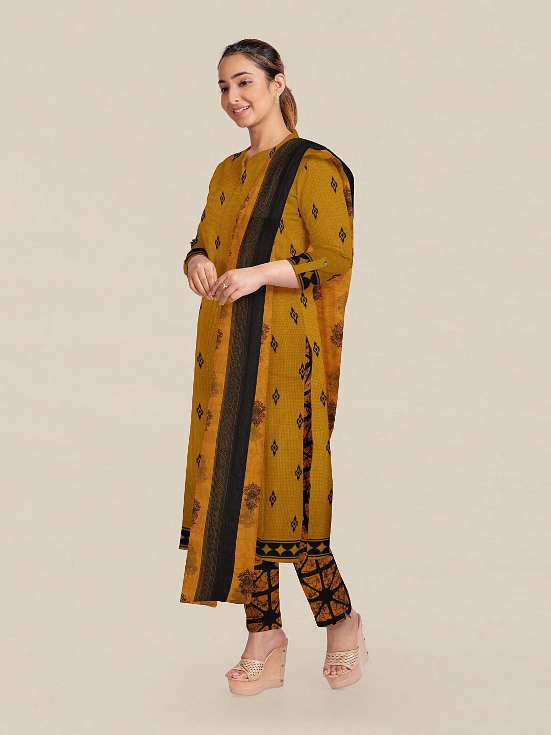 

Pothys Mustard & Black Printed Unstitched Dress Material